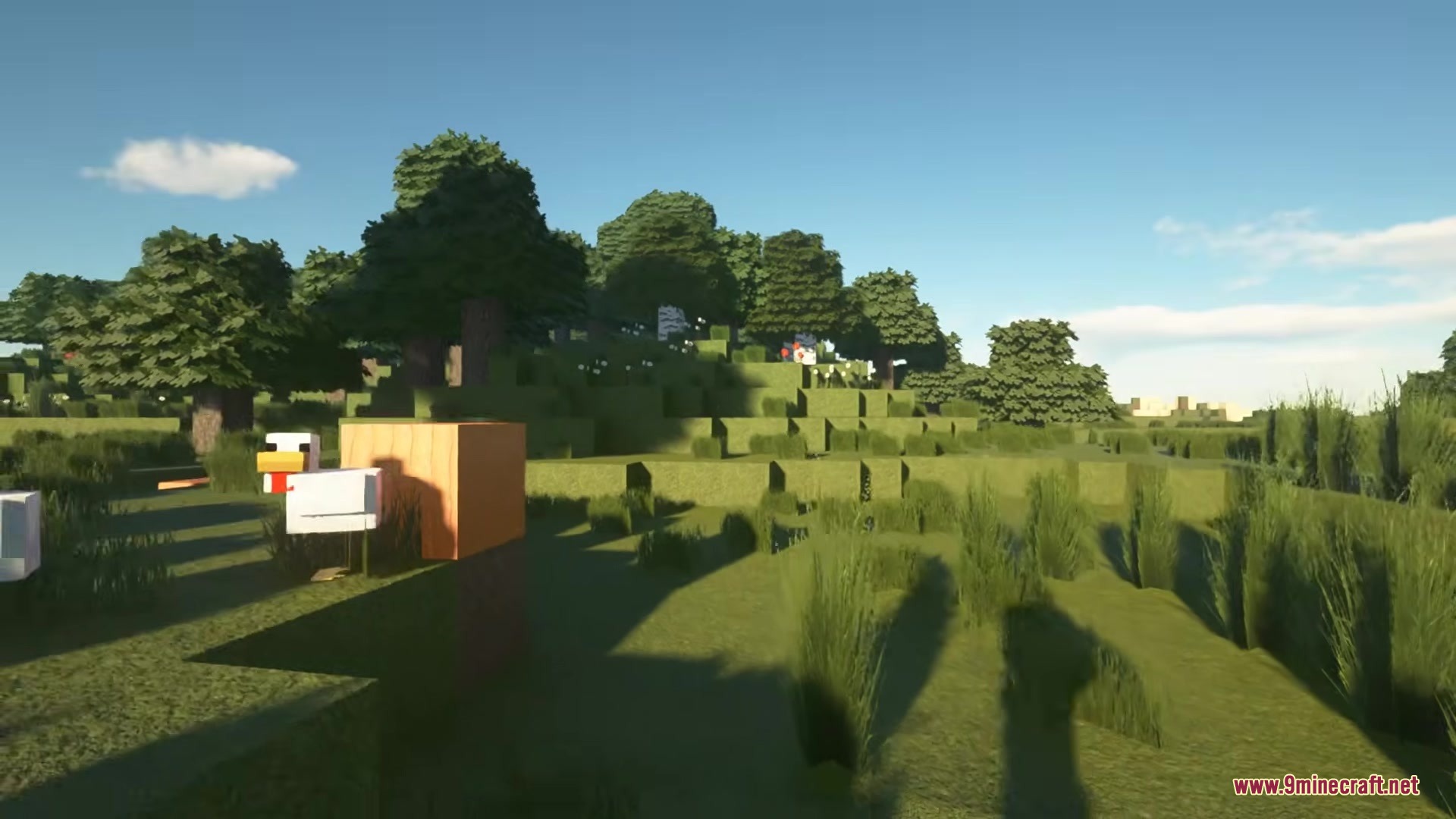 A BTV Texture Pack 64px Full 3 D POM Resource Pack Screenshot 3 A chicken stands on a grassy hill surrounded by lush green trees