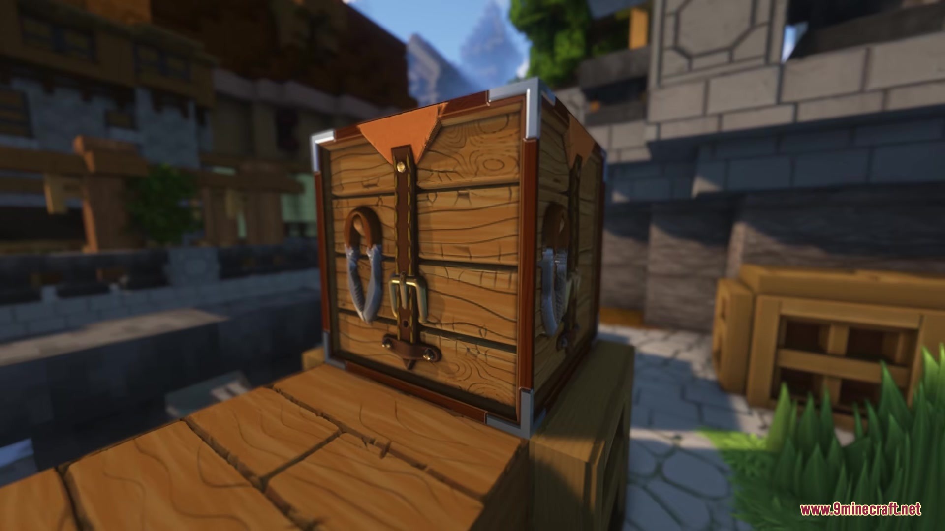 A BTV Texture Pack 64px Full 3 D POM Resource Pack Screenshot 7 A detailed 3D wooden chest with leather straps and metal buckles in Minecraft