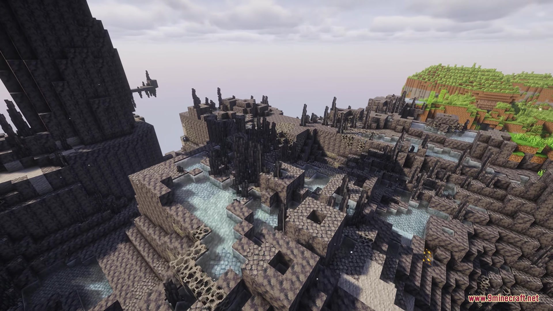 Aero Islands for Create Aeronautics Mod Screenshot 3 Dark jagged rock formations and water pools on floating islands in the void