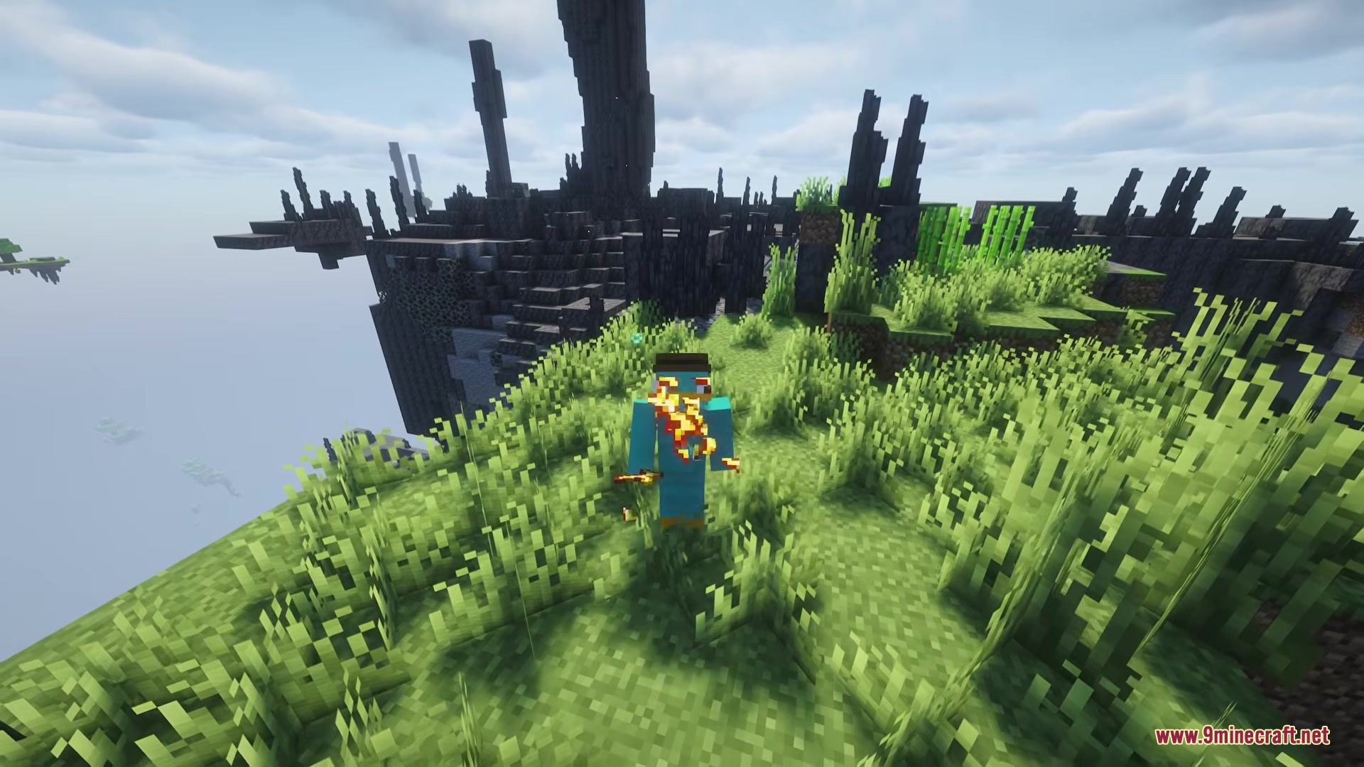 Aero Islands for Create Aeronautics Mod Screenshot 5 Minecraft player on fire standing on a grassy cliff overlooking the void