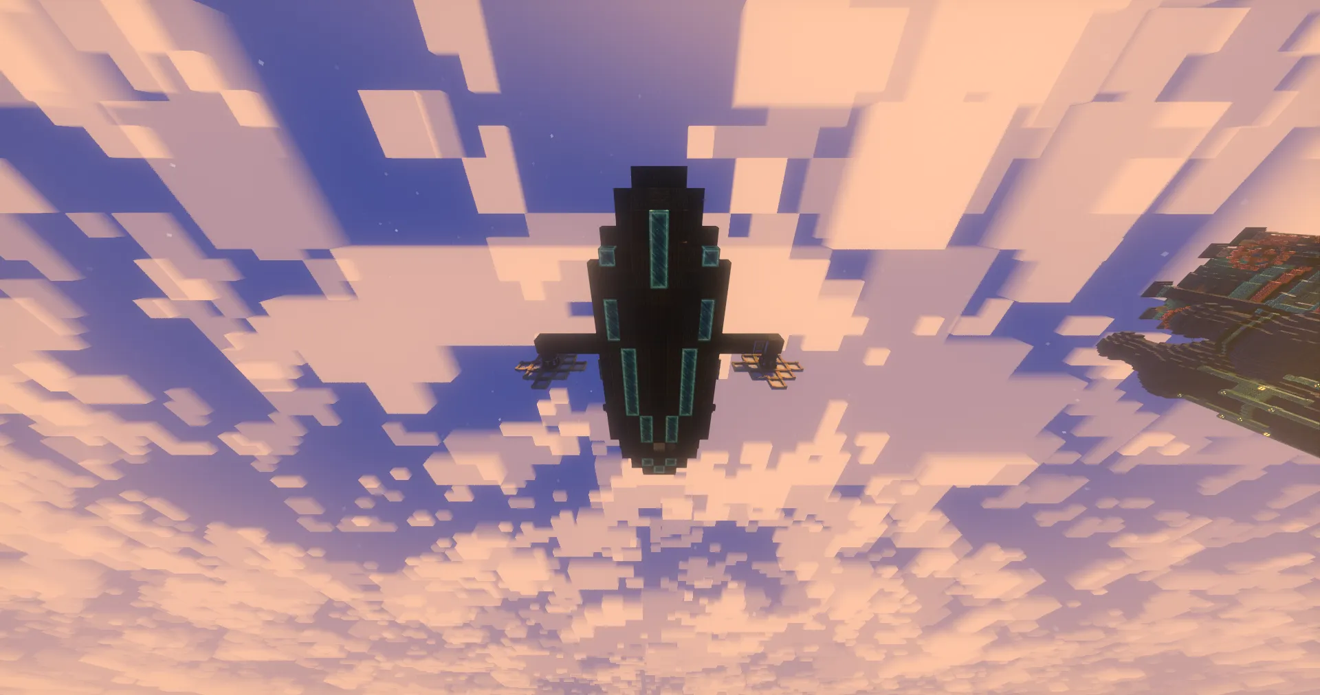 The bottom view of a dark airship soaring through a cloudy sky