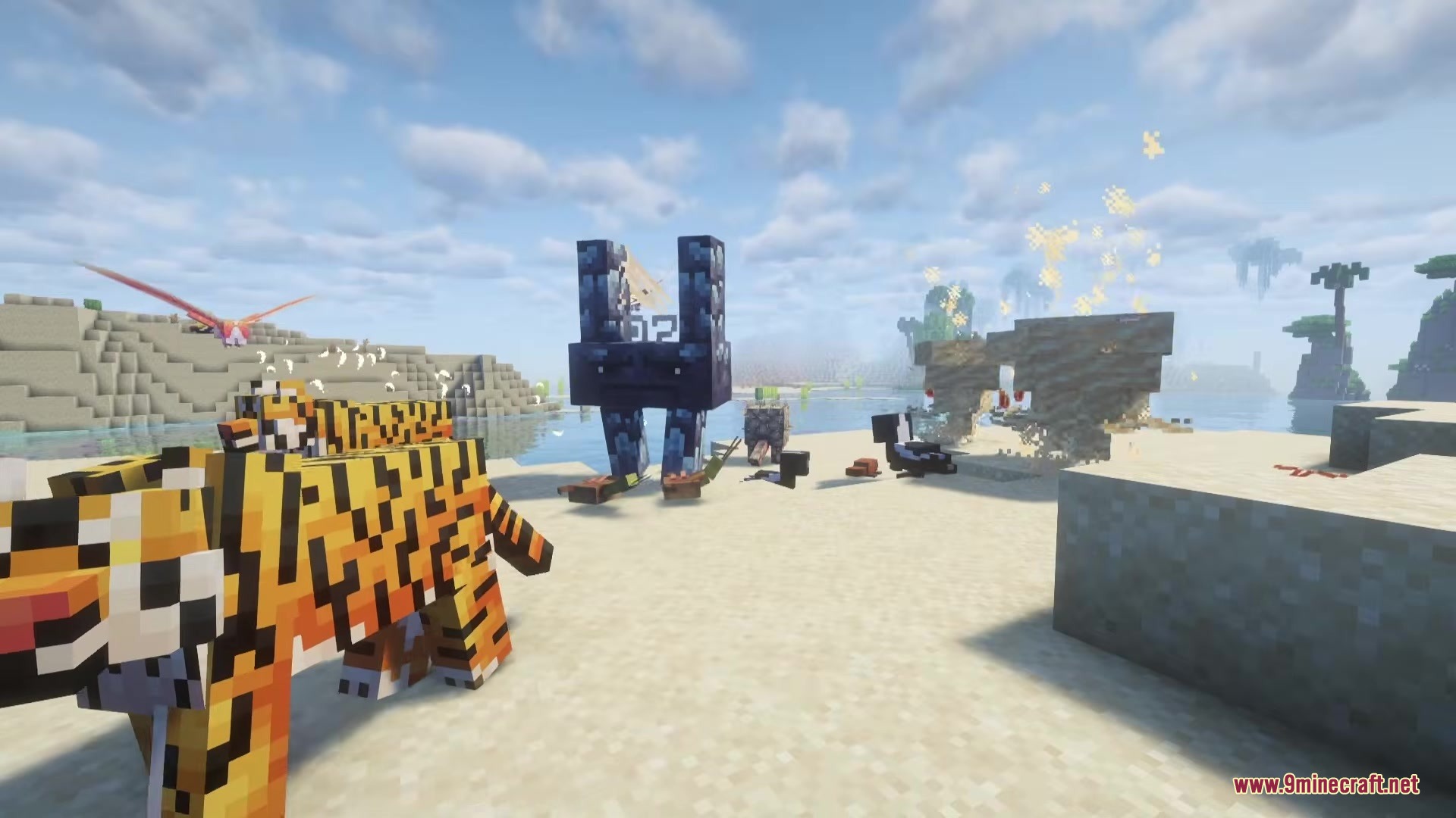 A tiger and a tall blue creature standing on the sand