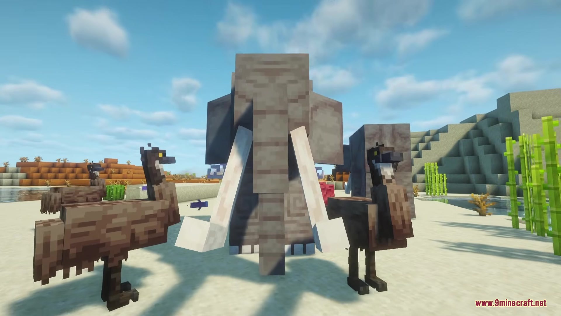 A large mammoth stands between two emus in a sunny desert biome