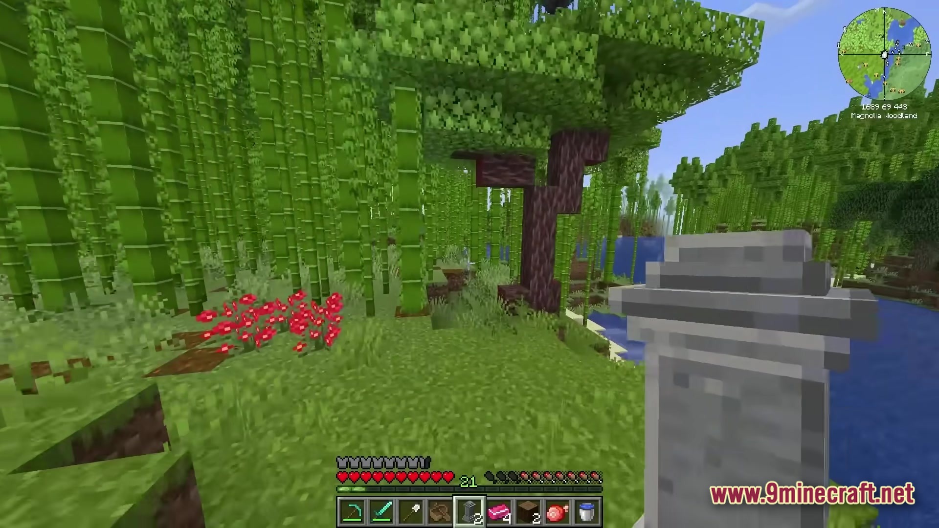 All The Mods 10 ATM10 Modpack Screenshot 4 A player holds a gravestone in a Magnolia Woodland biome filled with bamboo and custom trees