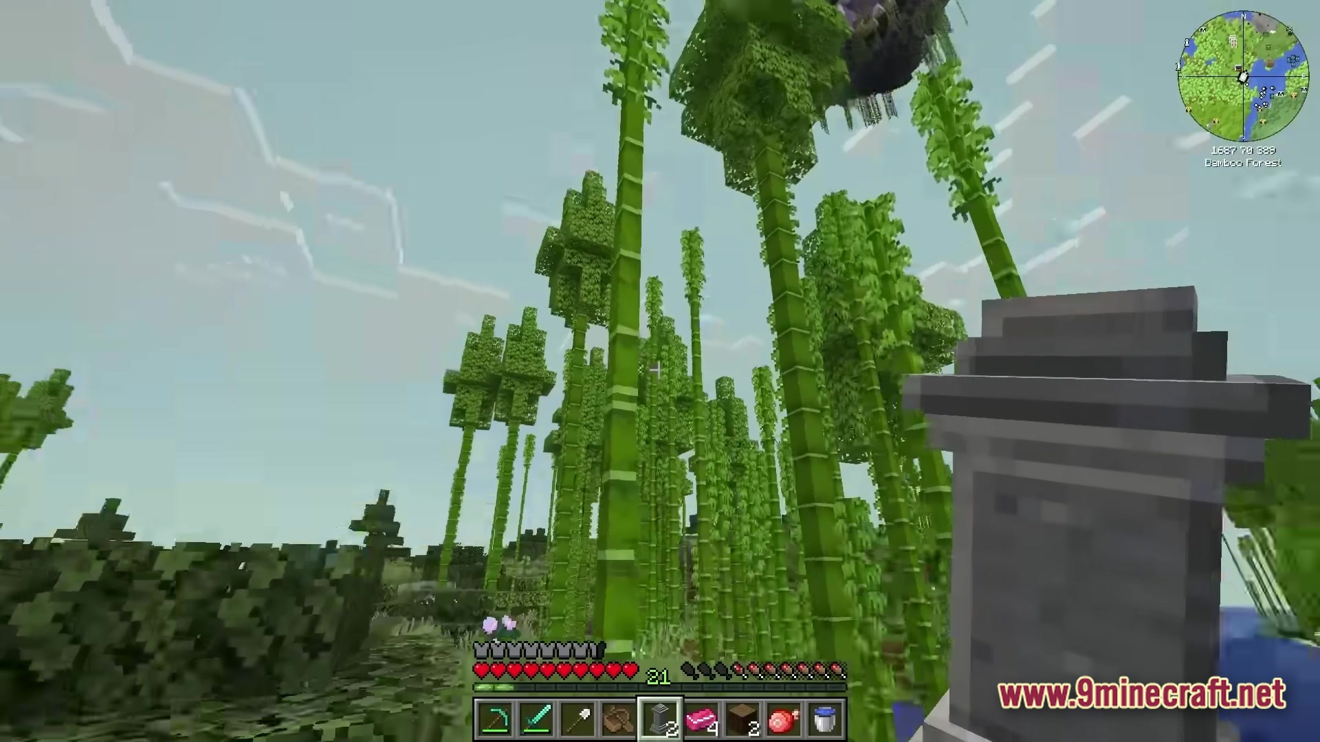 All The Mods 10 ATM10 Modpack Screenshot 5 A player stands in a bamboo forest biome holding a decorative stone pillar item