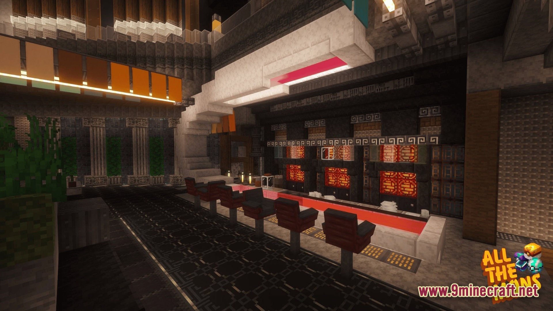 A modern interior build featuring a sleek counter with red seating and decorative lighting