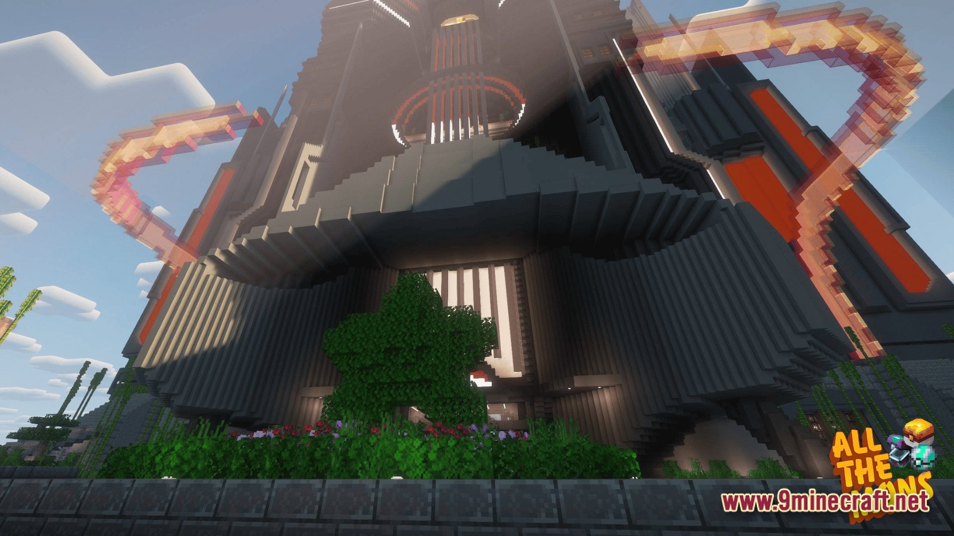 A massive futuristic dark-colored skyscraper featuring glowing orange accents and a garden at the base