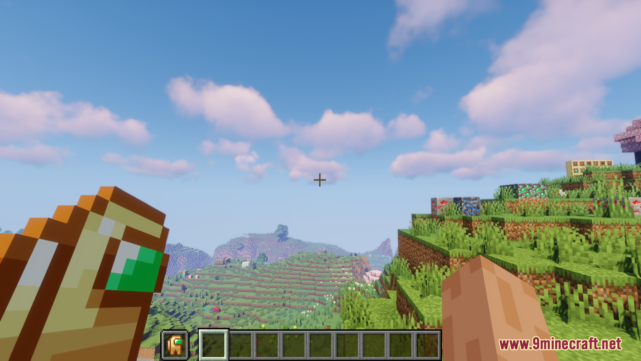 A player holding an Among Us crewmate totem in a scenic Minecraft landscape