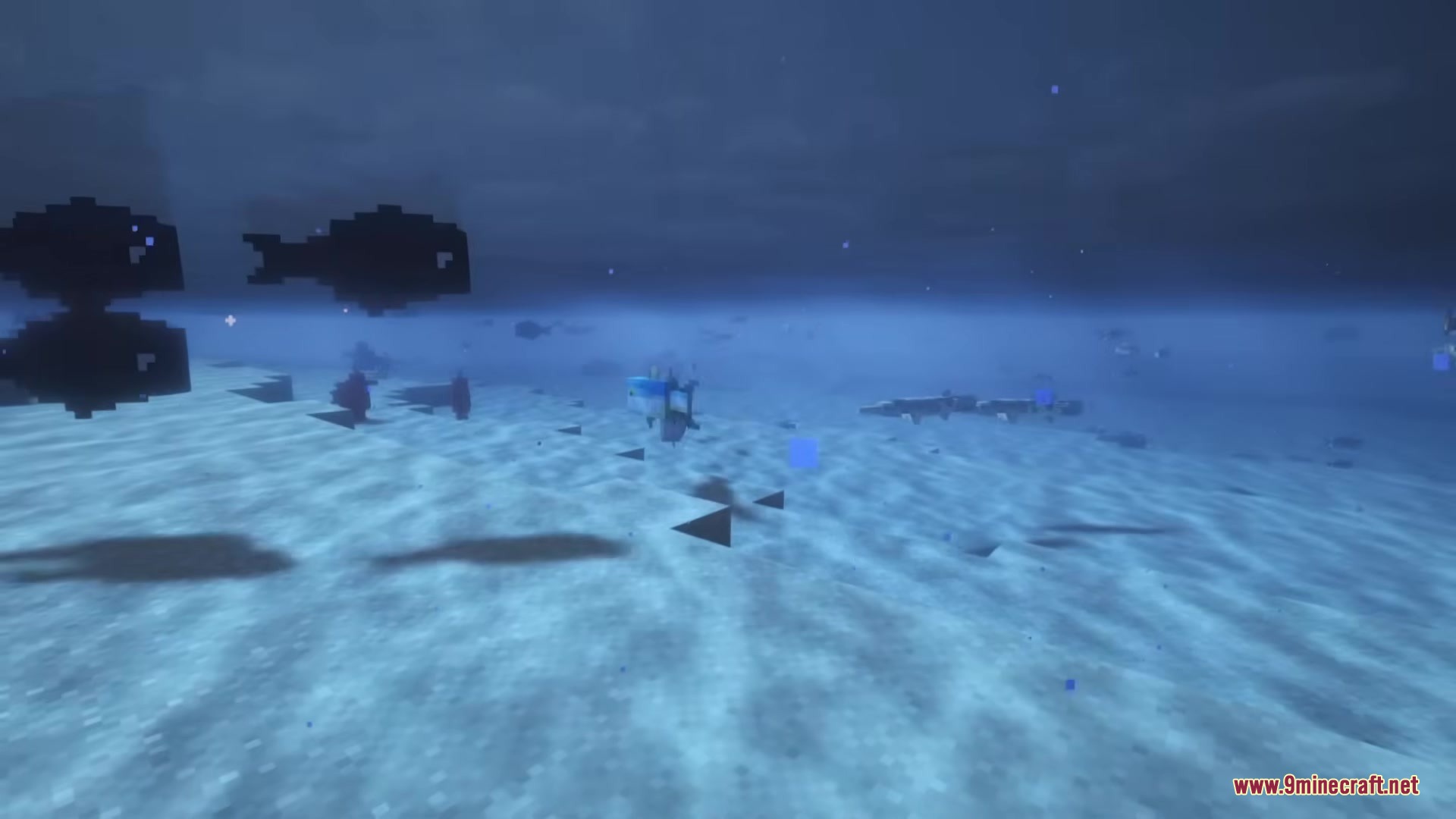 Aquatic Plus Mod Screenshot 1 Silhouettes of fish swimming in the dark depths of the ocean