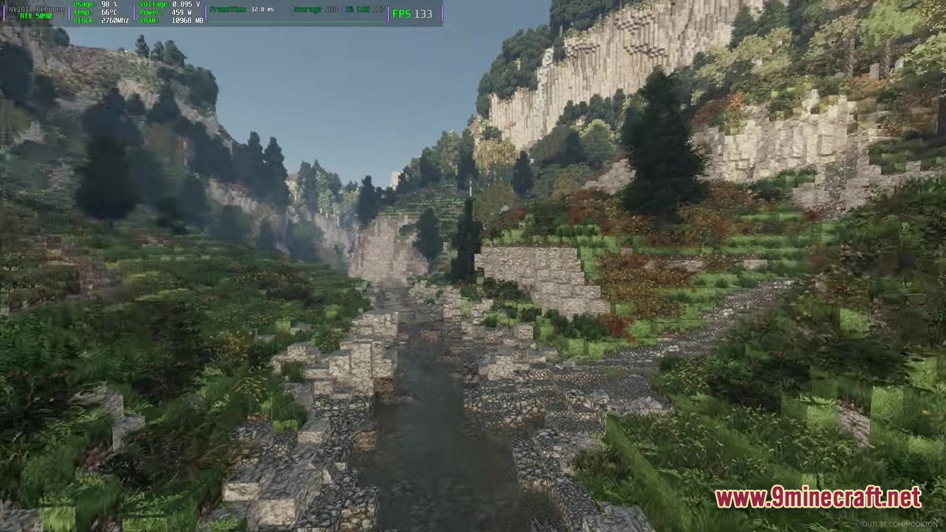 Arda Craft Modpack Screenshot 4 A narrow river flows through a steep, forested valley with rocky cliffs and stone terraces