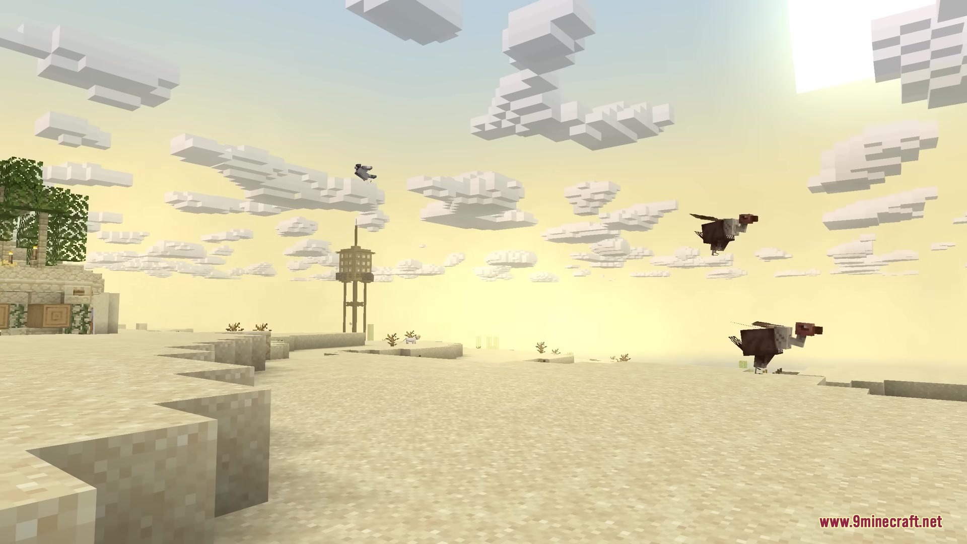Vultures flying over a desert landscape with a tall stone tower structure