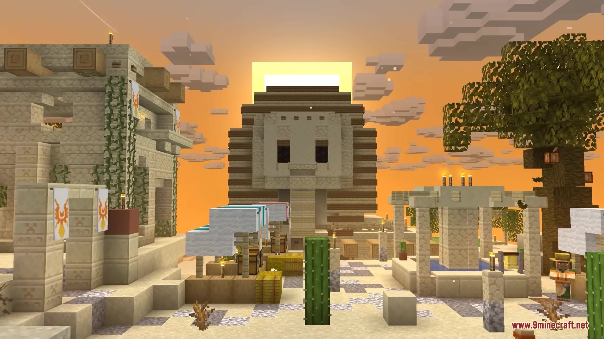 A majestic Sphinx structure stands in a desert village during a golden sunset