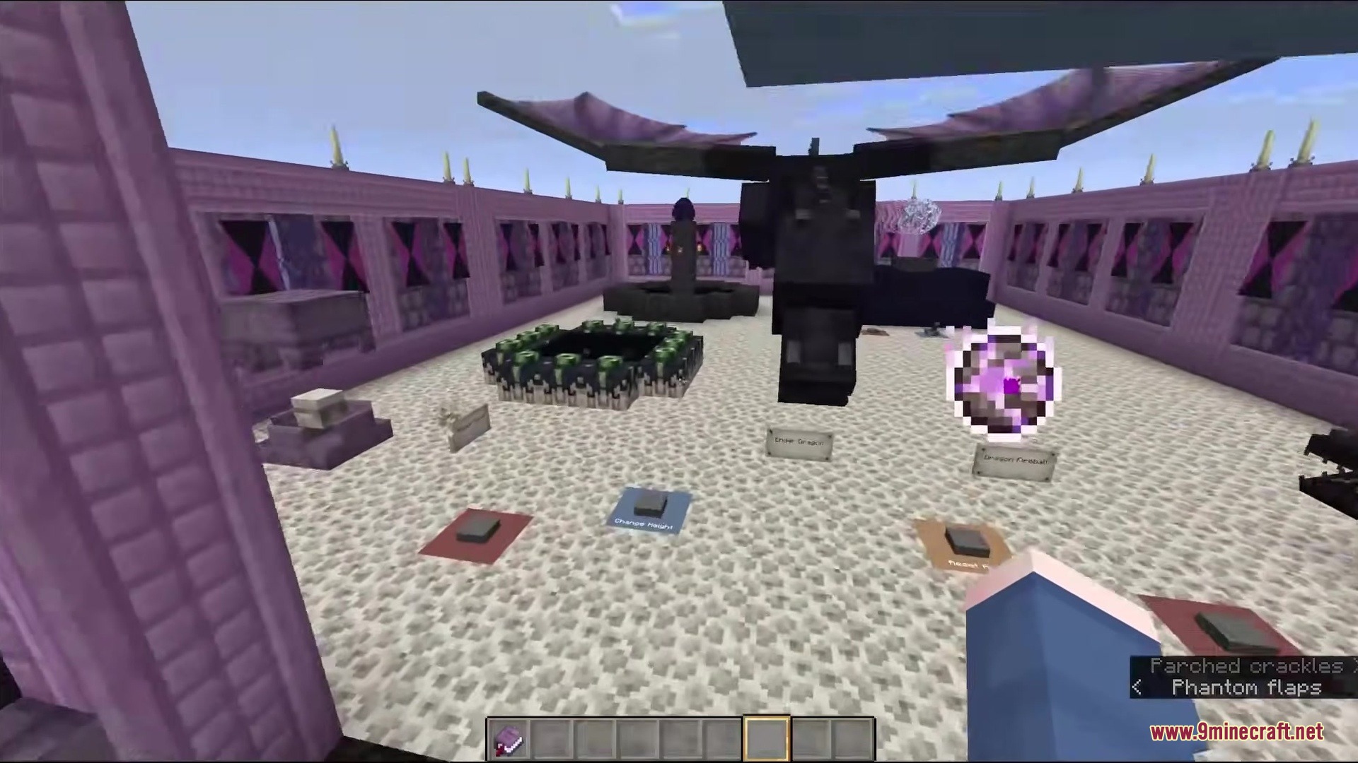 An Ender Dragon model and End Portal inside a large purple room