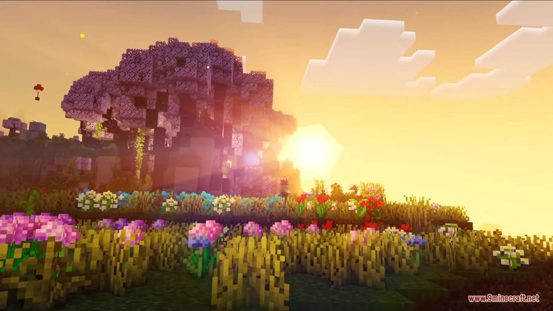 Authback Mod Screenshot 1 A giant purple tree standing in a vibrant flower field at sunset