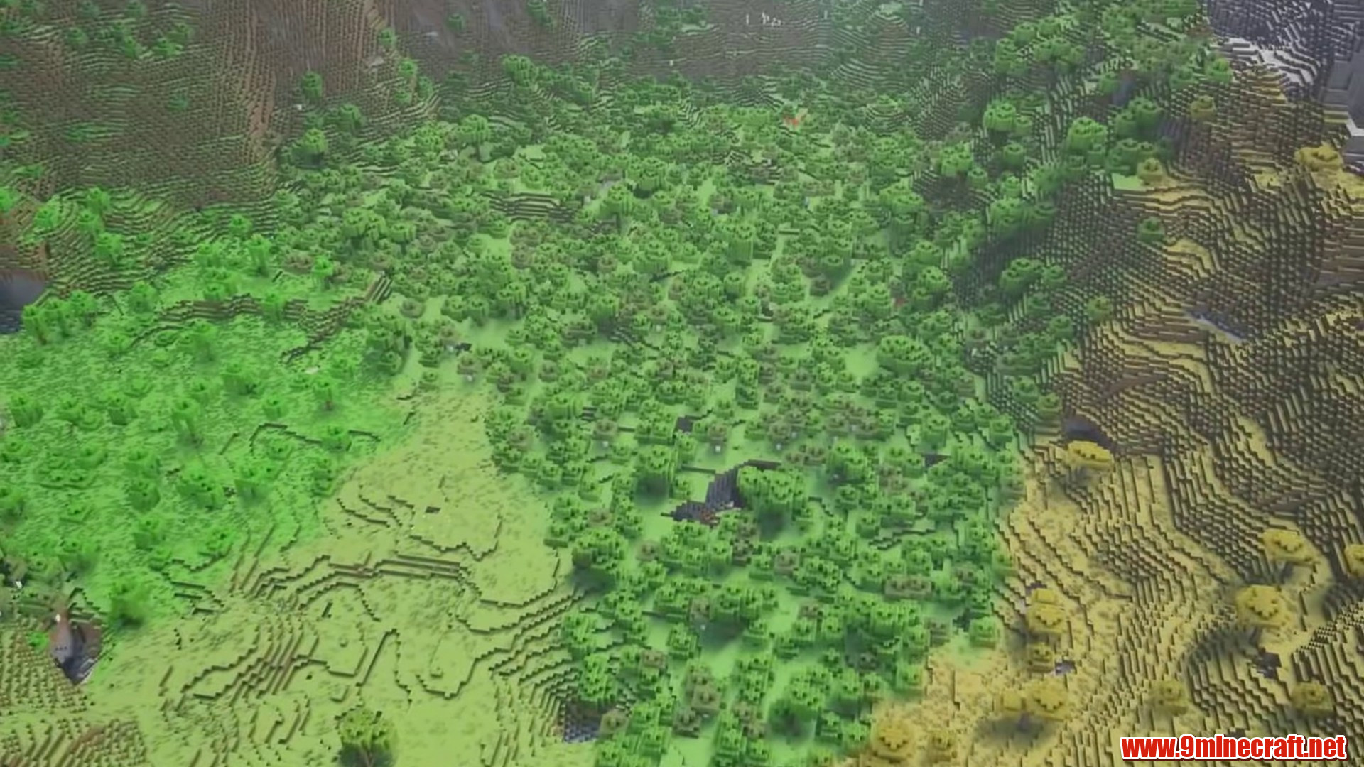 Wide green valley floor between mountain ridges
