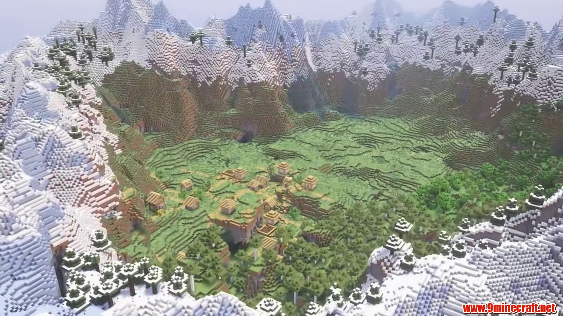 Village valley enclosed by snowy mountains
