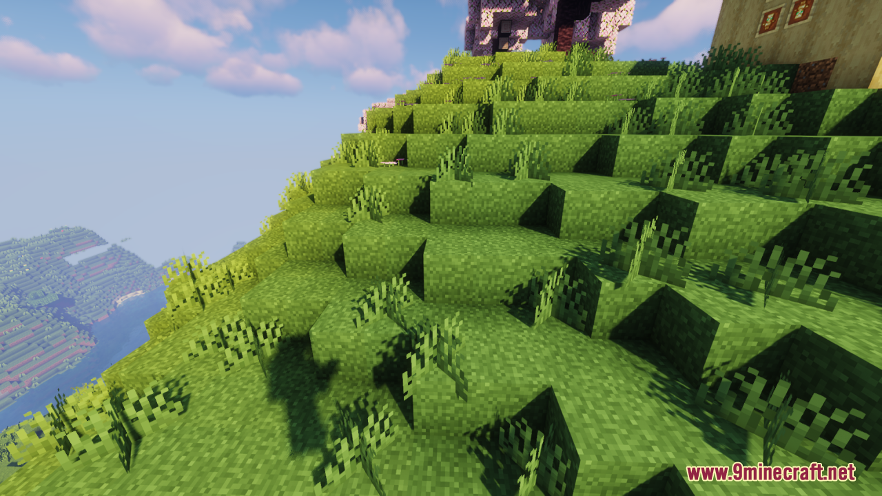 A lush green hillside showing connected grass textures under a blue sky
