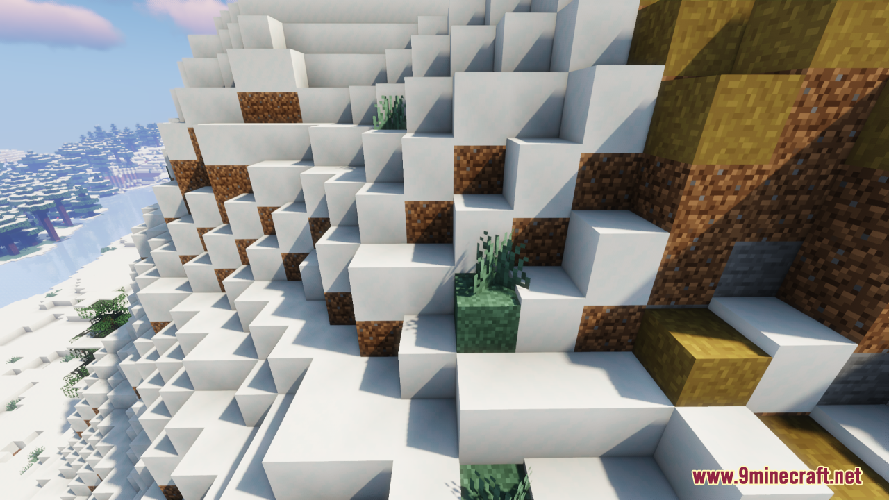 Snowy mountain landscape featuring connected grass textures on the side of blocks