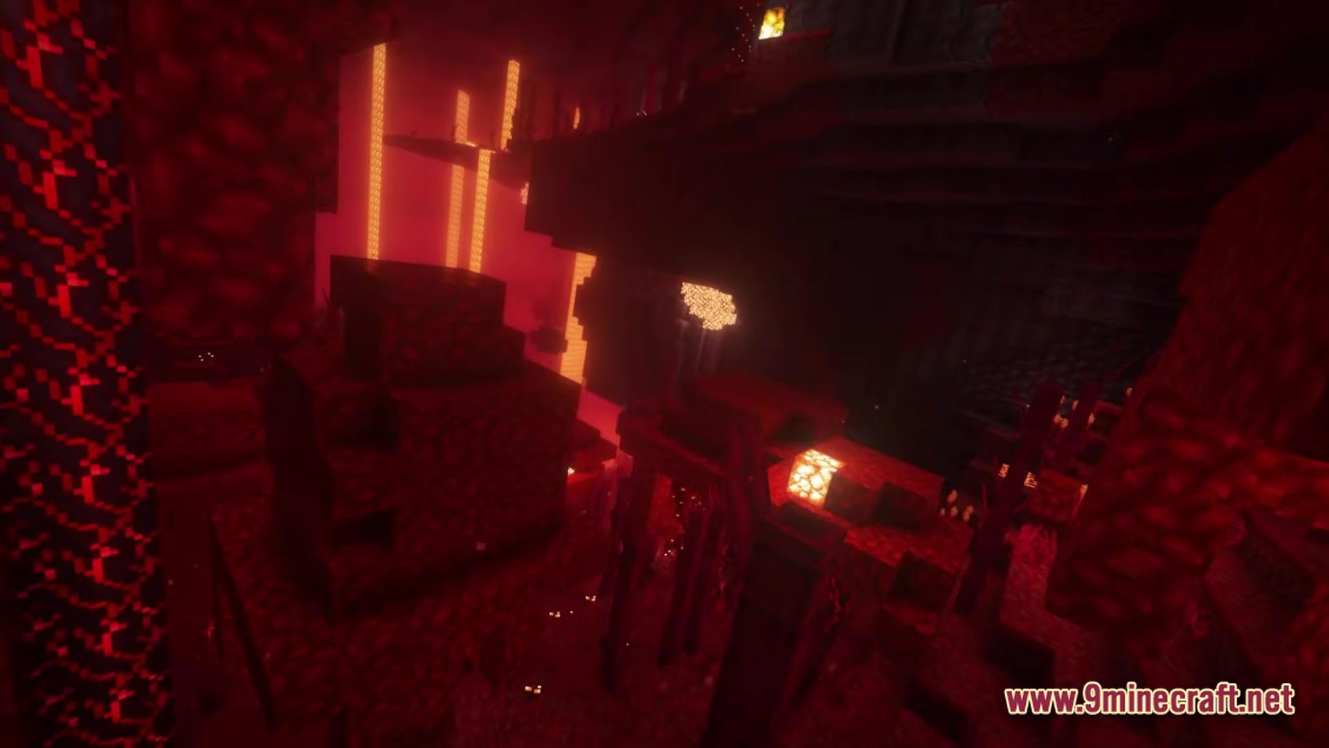 Better MC BMC5 Modpack Screenshot 1 A dark Nether cavern featuring lava falls, glowstone, and various red netherrack rock formations