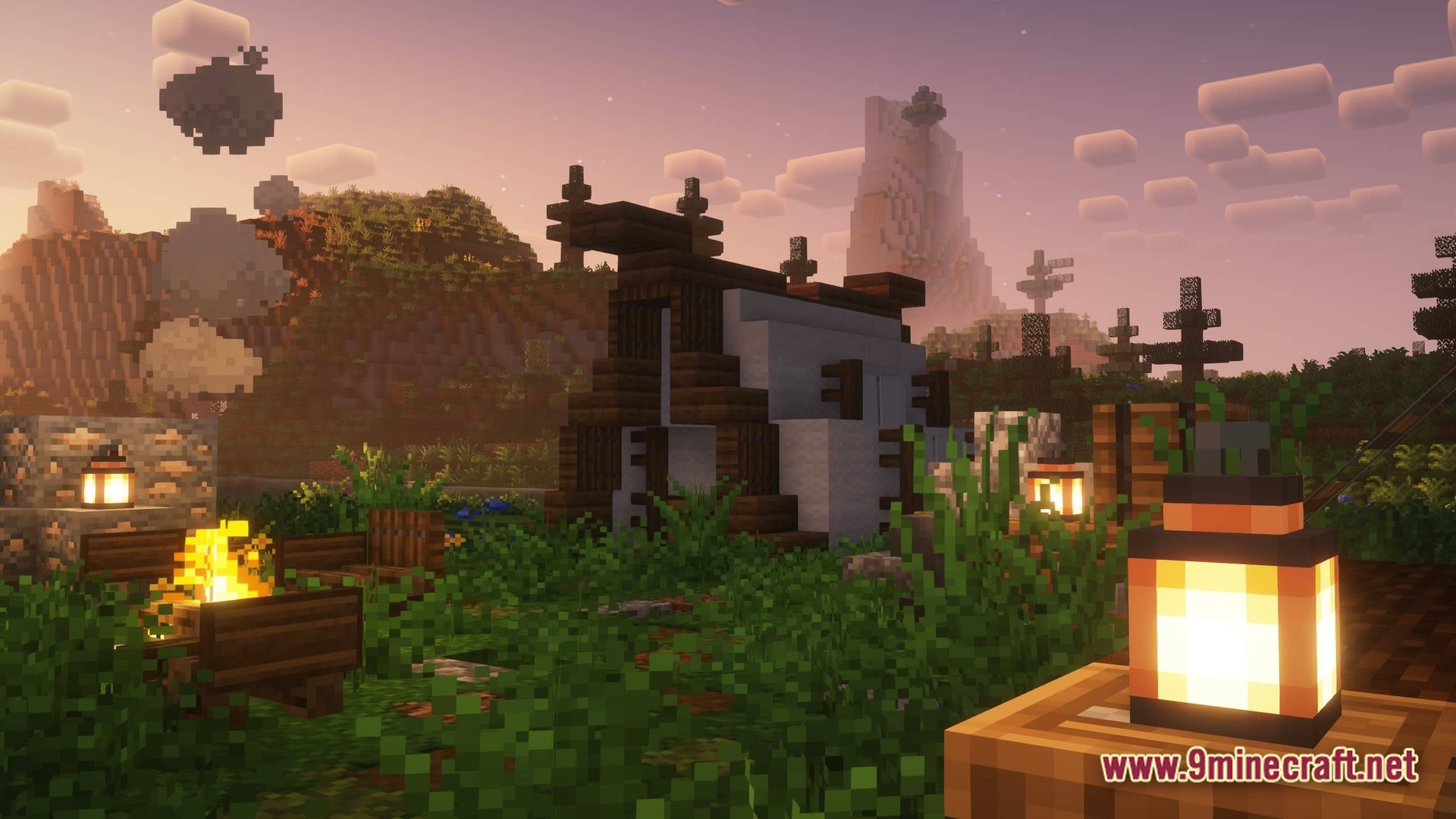 Better MC FORGE BMC4 Modpack Screenshot 6 A small wooden and wool structure sits near a campfire at sunset in a hilly biome