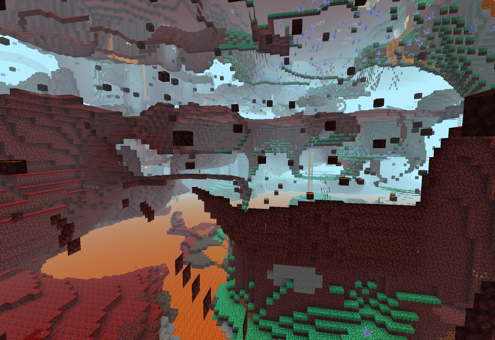 The crimson glowing woods biome - crimson terrain covered in nether grass and small glowing plants under a pale mist.