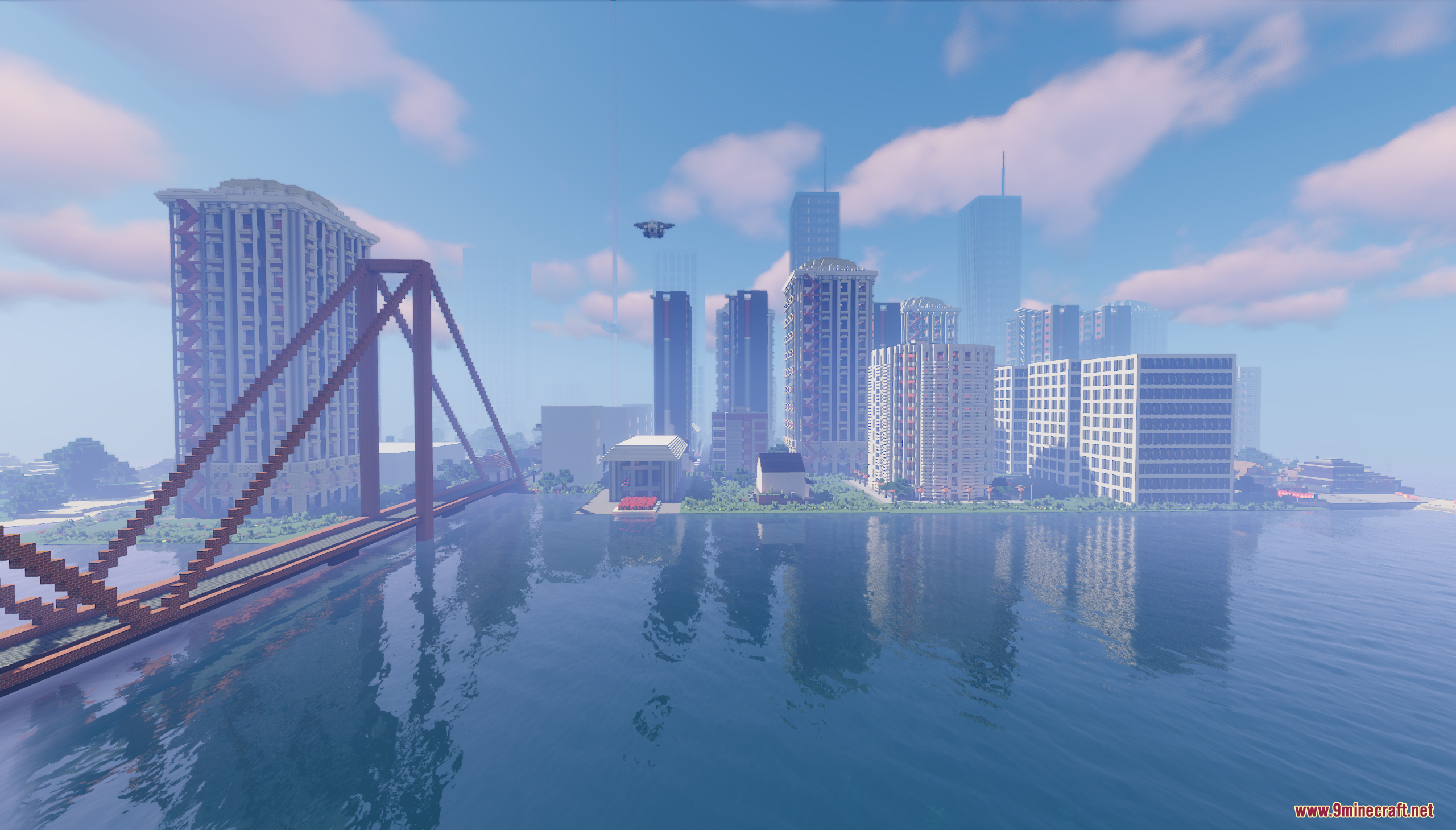 A large red bridge leads to a modern city skyline across the water