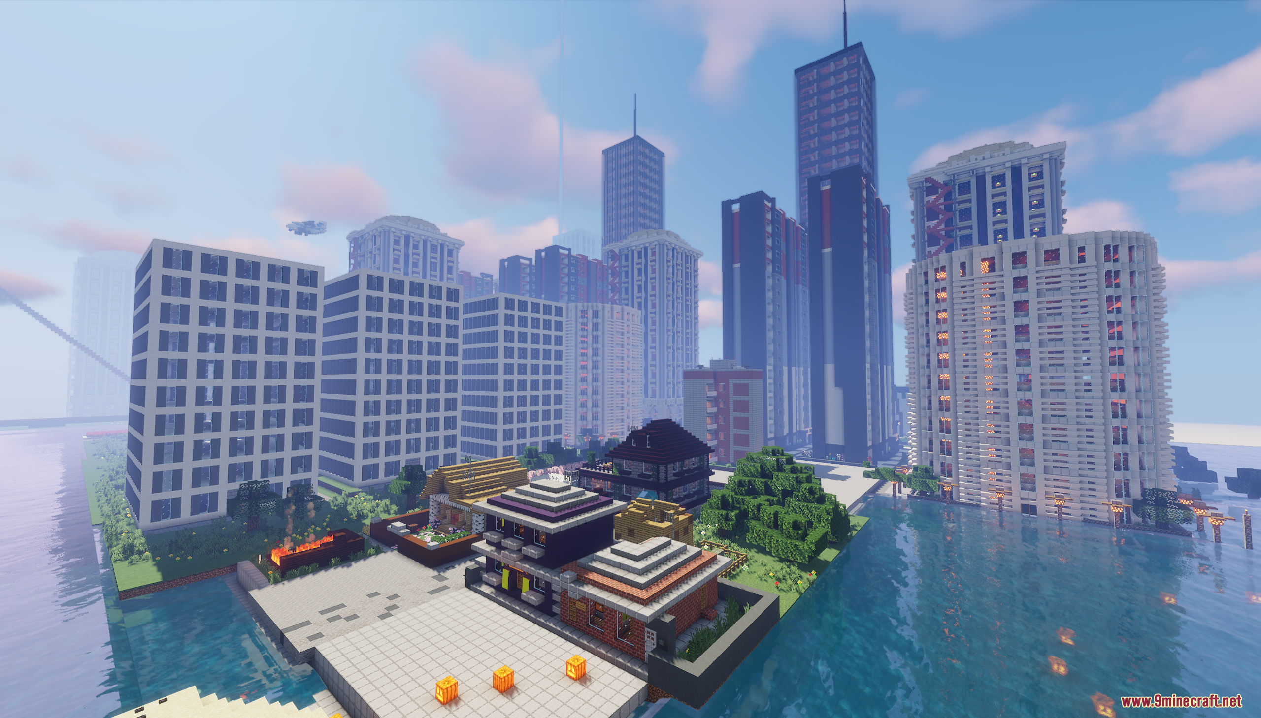 Tall glass skyscrapers and small houses overlooking a calm river in the city