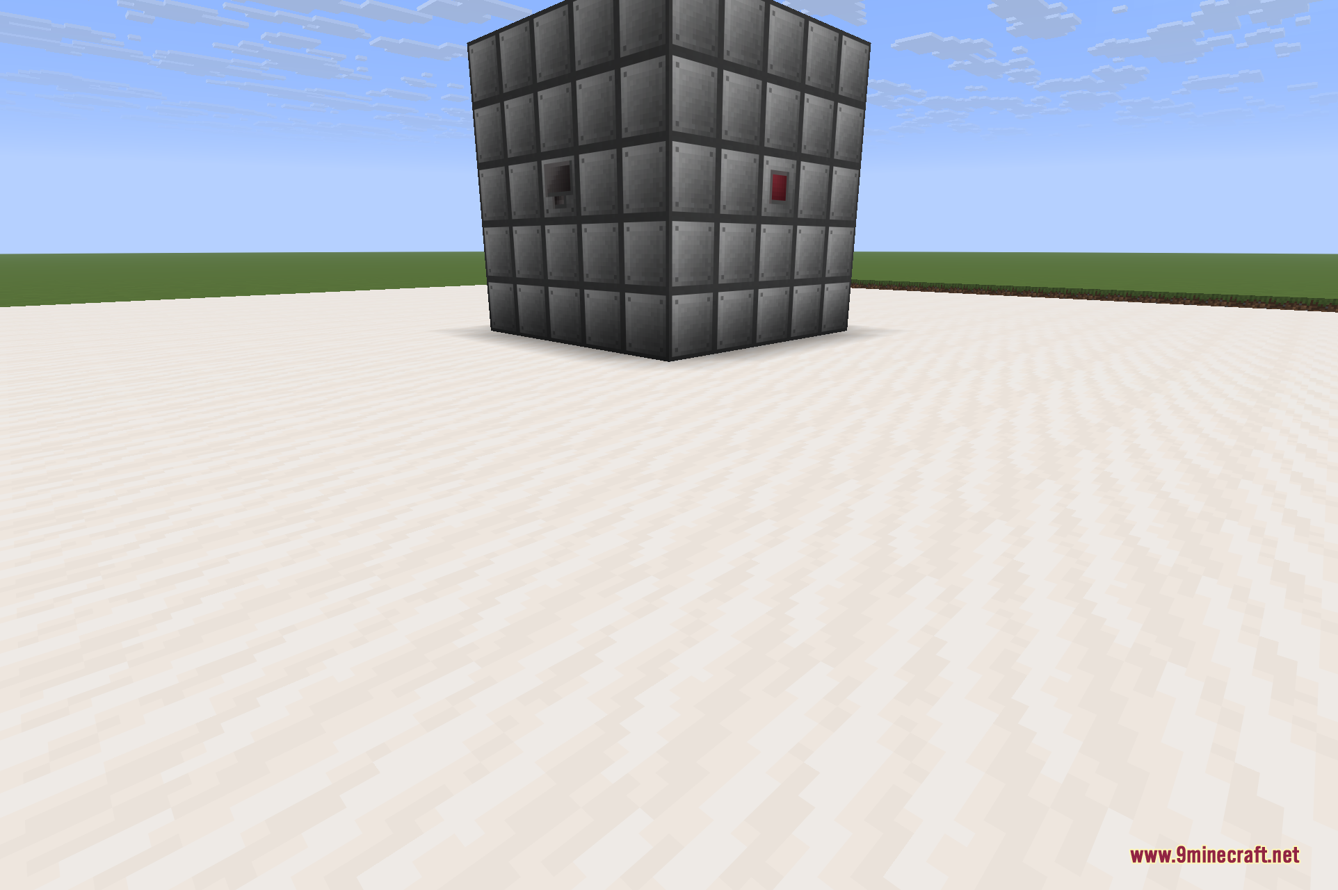 A finished multiblock Reactor viewed from the front, its casing fitted with an access port and a control rod, ready to be fuelled and activated.