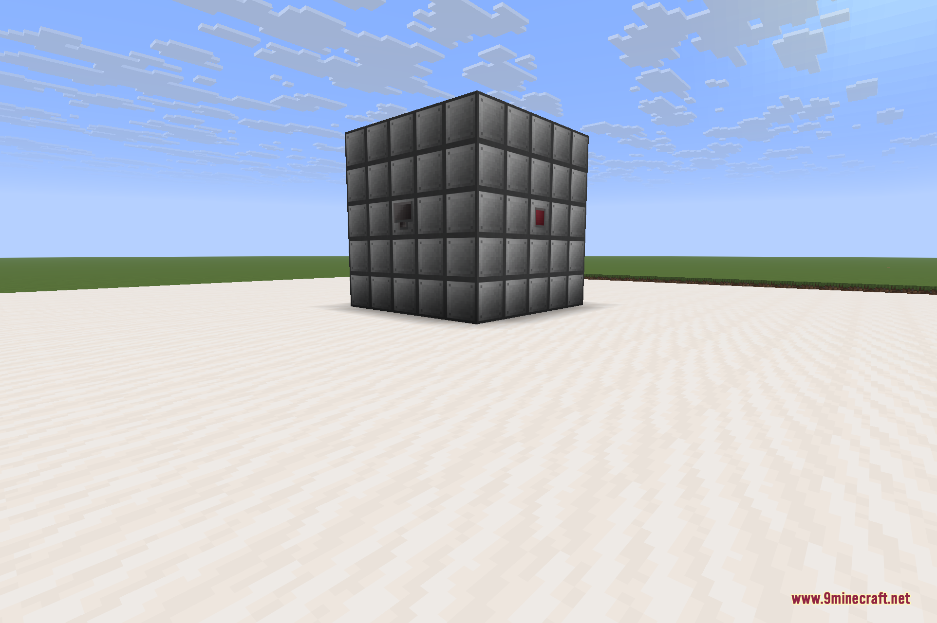 A completed multiblock Reactor built from reactor casing, with an access port on one face for inserting Yellorium fuel and a control rod set into the wall.