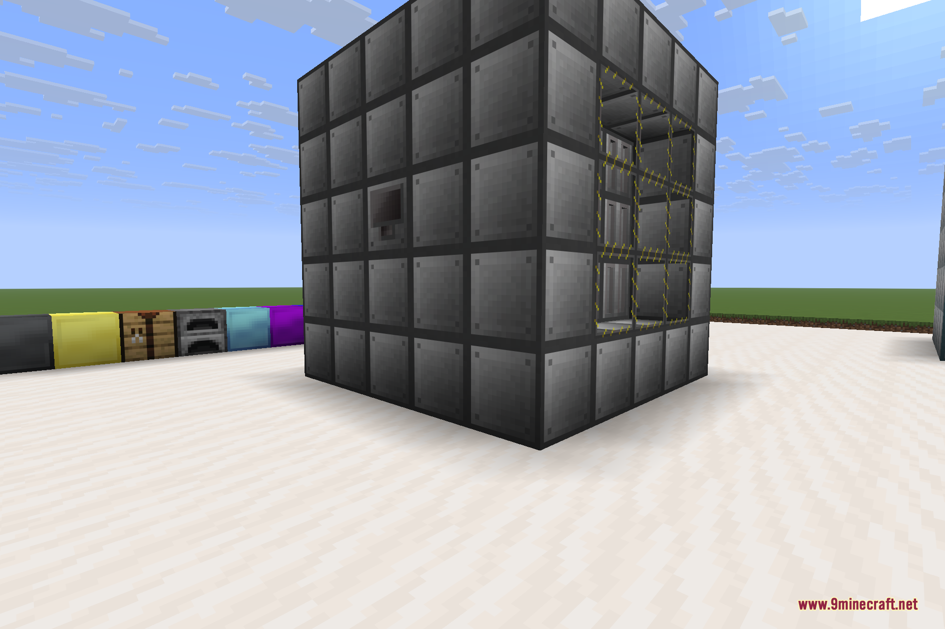 A closer angled view of a Reactor, with the fuel rod columns visible through the reactor glass and a row of reactor blocks laid out beside it.
