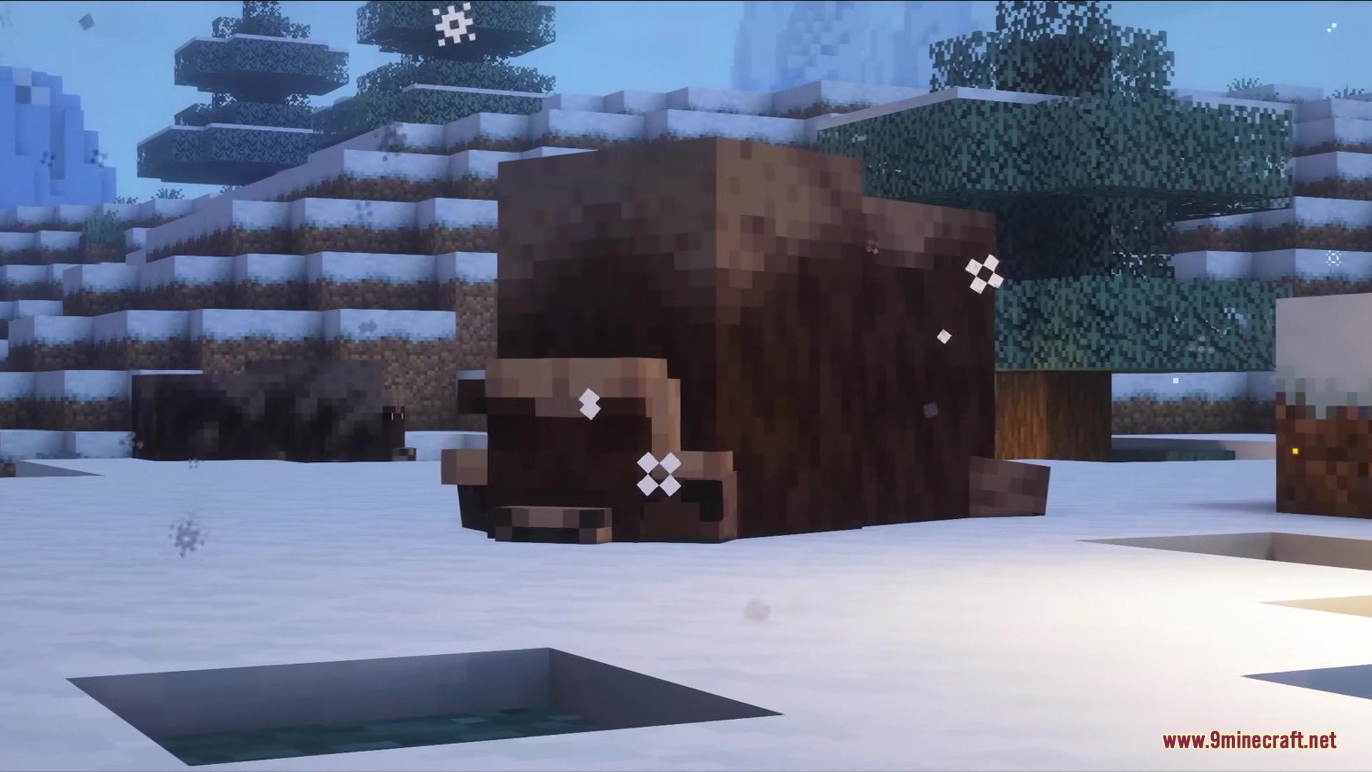 A musk ox standing in a snowy Minecraft mountain landscape