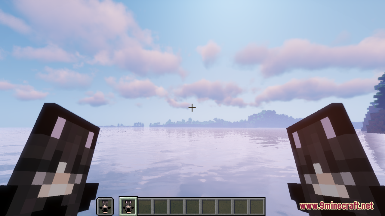 A player holding two Black Girlfriend Totems of Undying over a scenic ocean