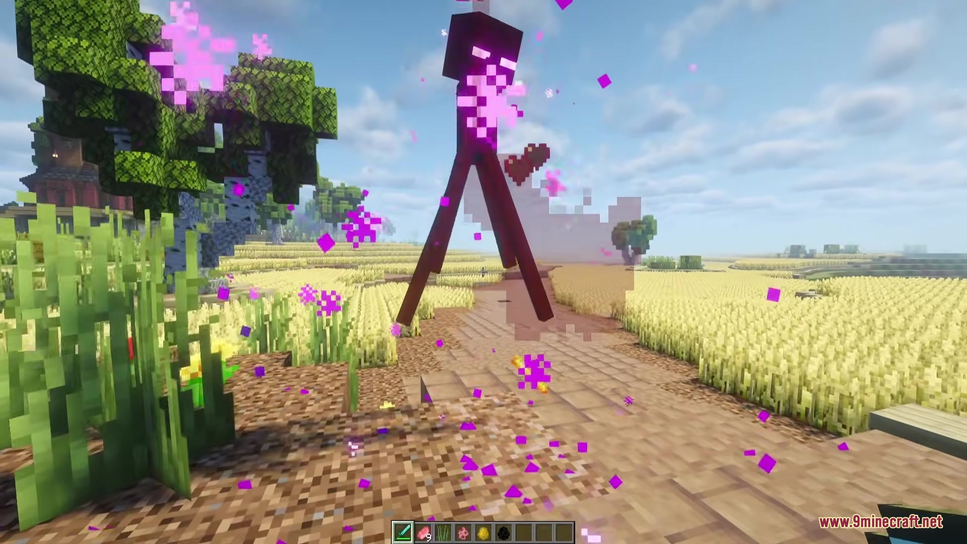 Blood Bits Mod Screenshot 5 Purple particles scatter as an Enderman takes damage in a wheat field