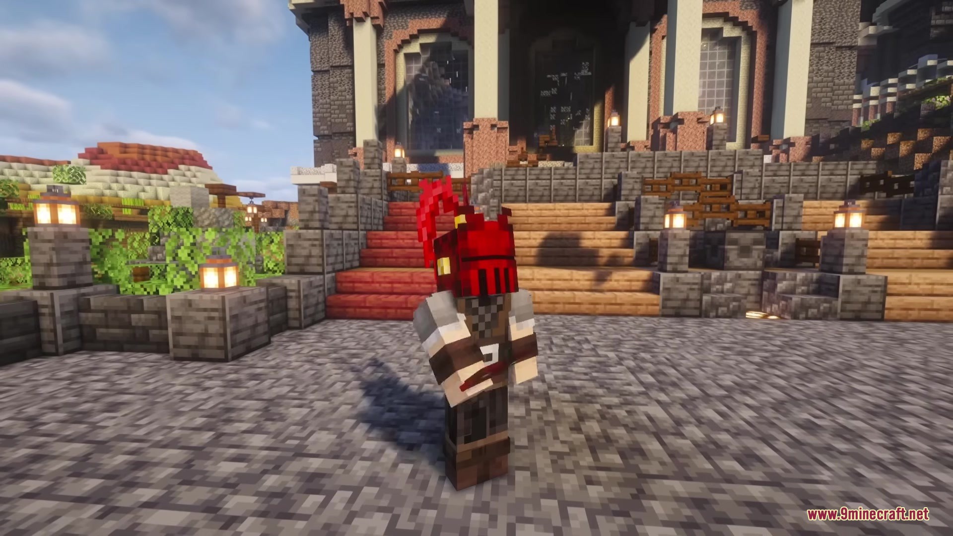 Bloody Hell Mod Screenshot 1 A Minecraft player wearing a red helmet stands in front of a large building