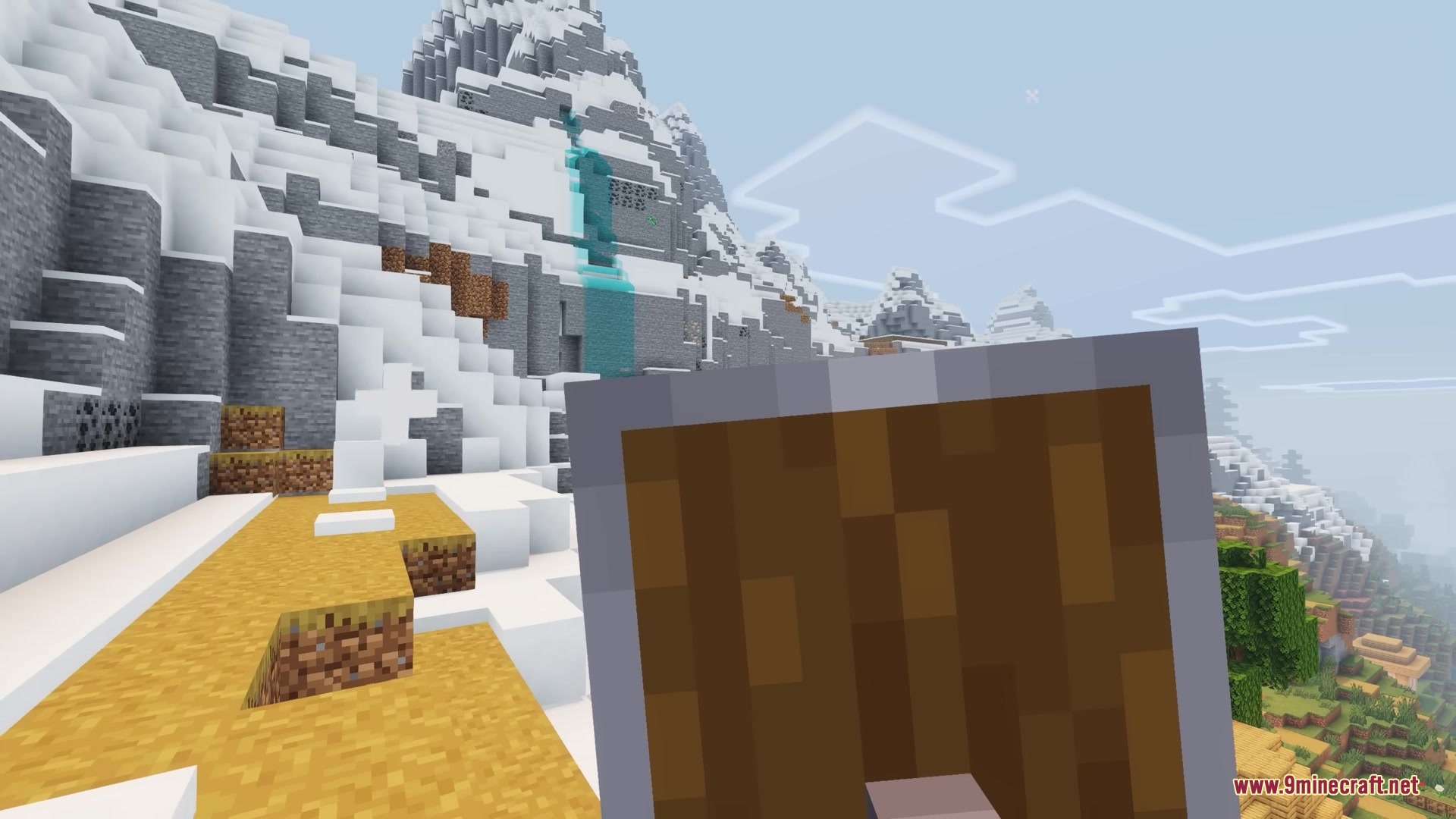 Brush and Juice Resource Pack Screenshot 4 A player holds a wooden shield in a snowy mountain landscape
