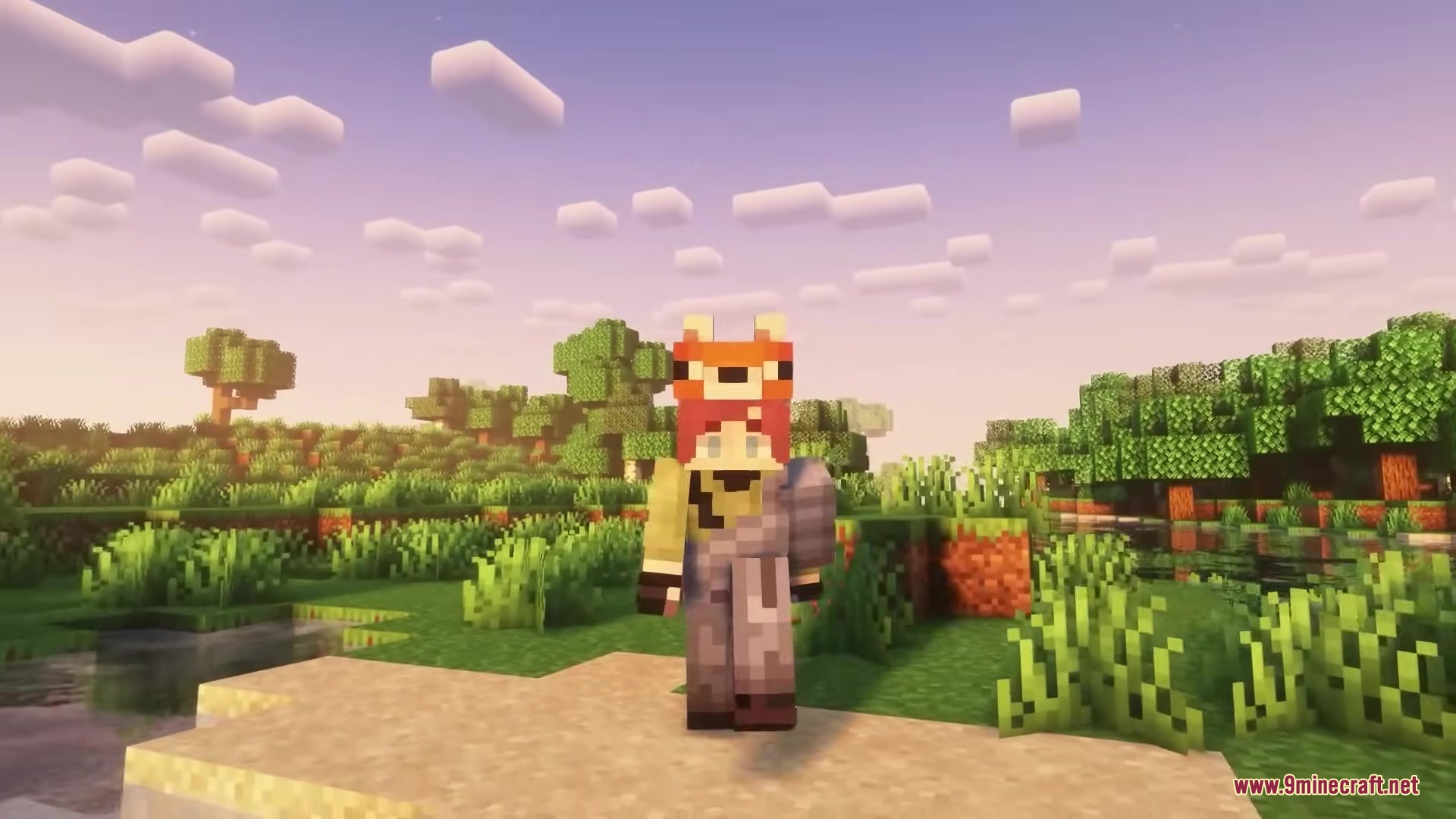 Buko's Enchantment Tips Resource Pack Screenshot 7 Minecraft player wearing a fox hat stands on a beach at sunset