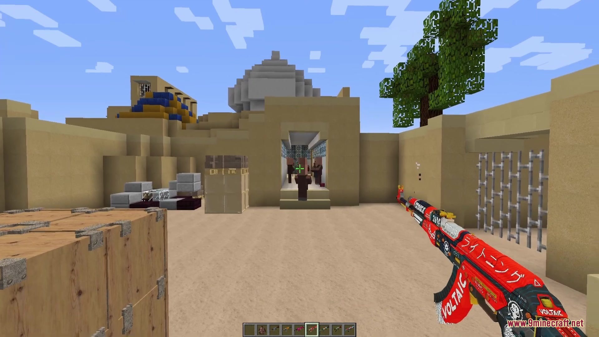 C Strifiky Resource Pack Screenshot 1 Player holding a custom assault rifle while looking at desert village mobs