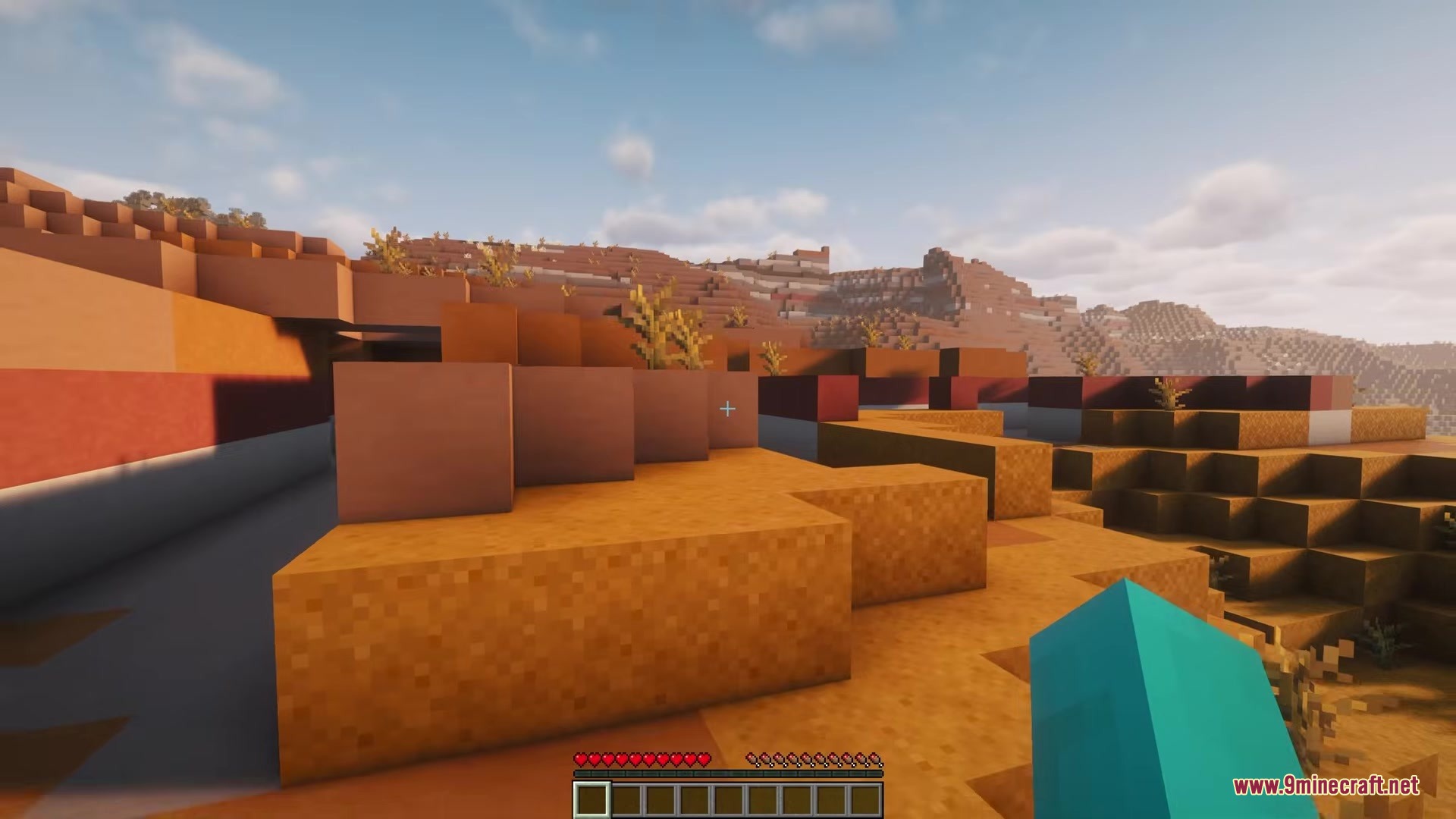 Camera Overhaul by Mirsario Mod Screenshot 1 First person view of a badlands biome with a dynamic tilted camera
