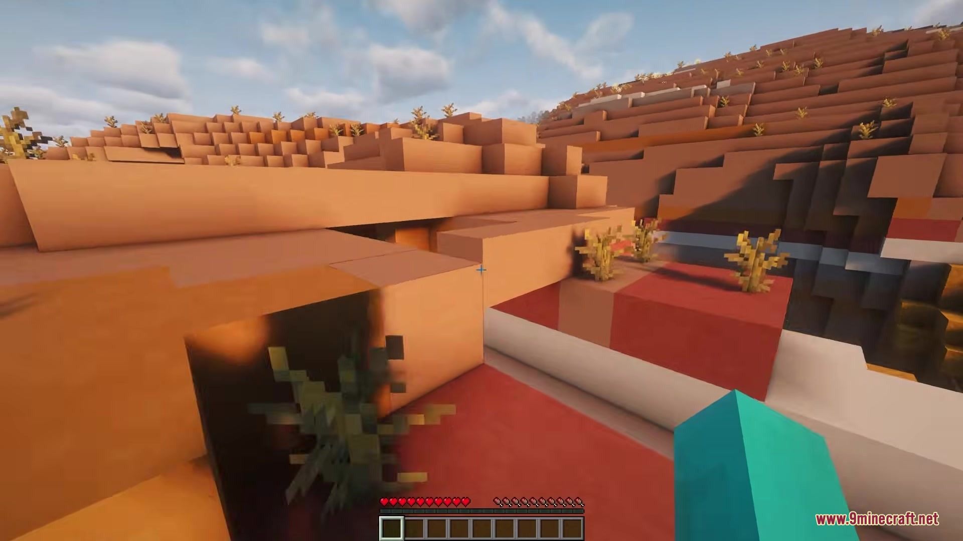 Camera Overhaul by Mirsario Mod Screenshot 5 First person view of a player exploring a badlands biome with camera tilt