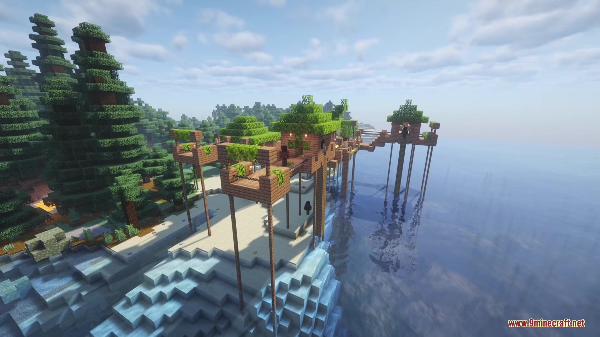 Cannibal Villages Mod Screenshot 3 Wooden tribal village structures built on tall stilts along the sandy coastline