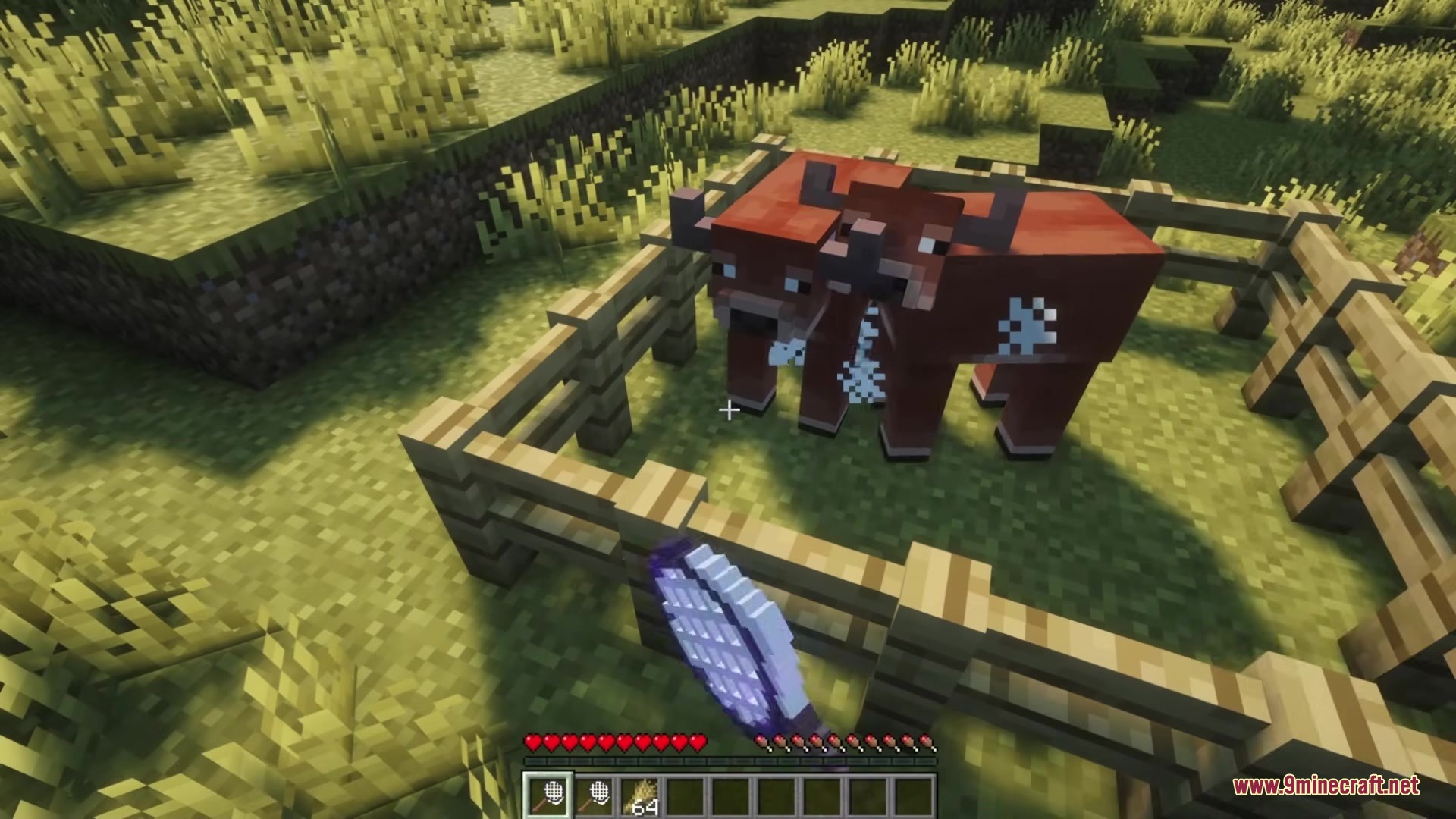 Capture Nets Mod Screenshot 2 A player uses a capture net to catch a cow inside a fence