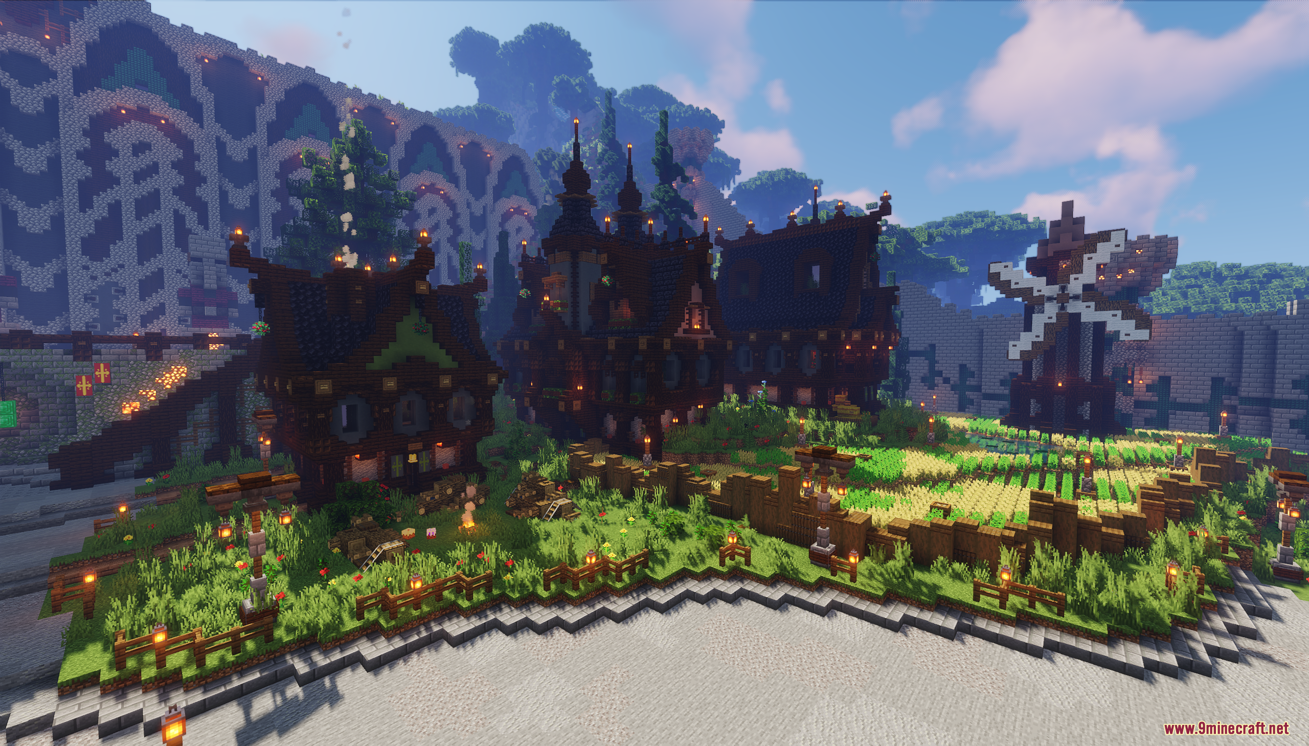 A medieval Minecraft village with dark houses a windmill and wheat field
