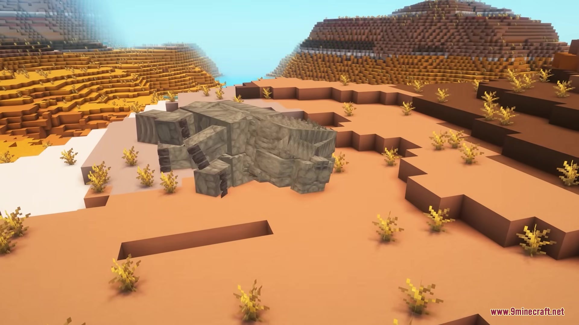 Catzilla Mod Screenshot 5 A giant Catzilla monster lying down on the sand in a desert biome