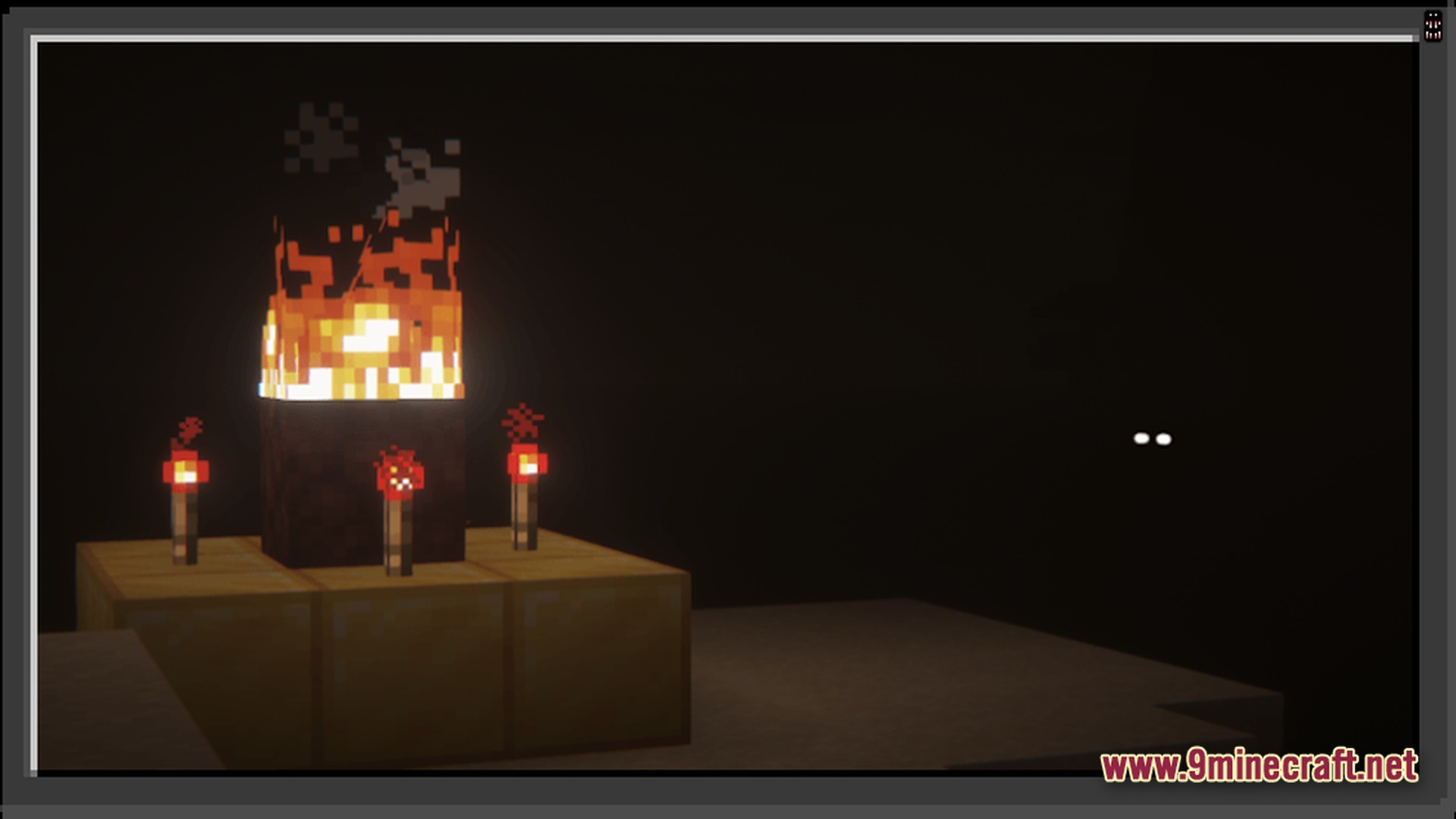 Cave Horror Project 1 Modpack Screenshot 2 A lit Herobrine shrine made of gold, netherrack, and redstone torches in a dark cave