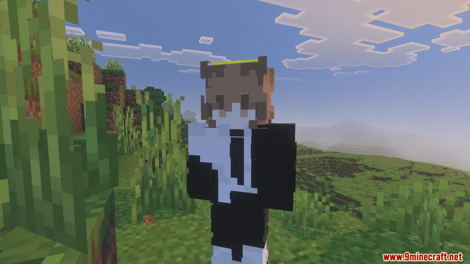 Anime character with a halo and suit standing in a green grassy biome