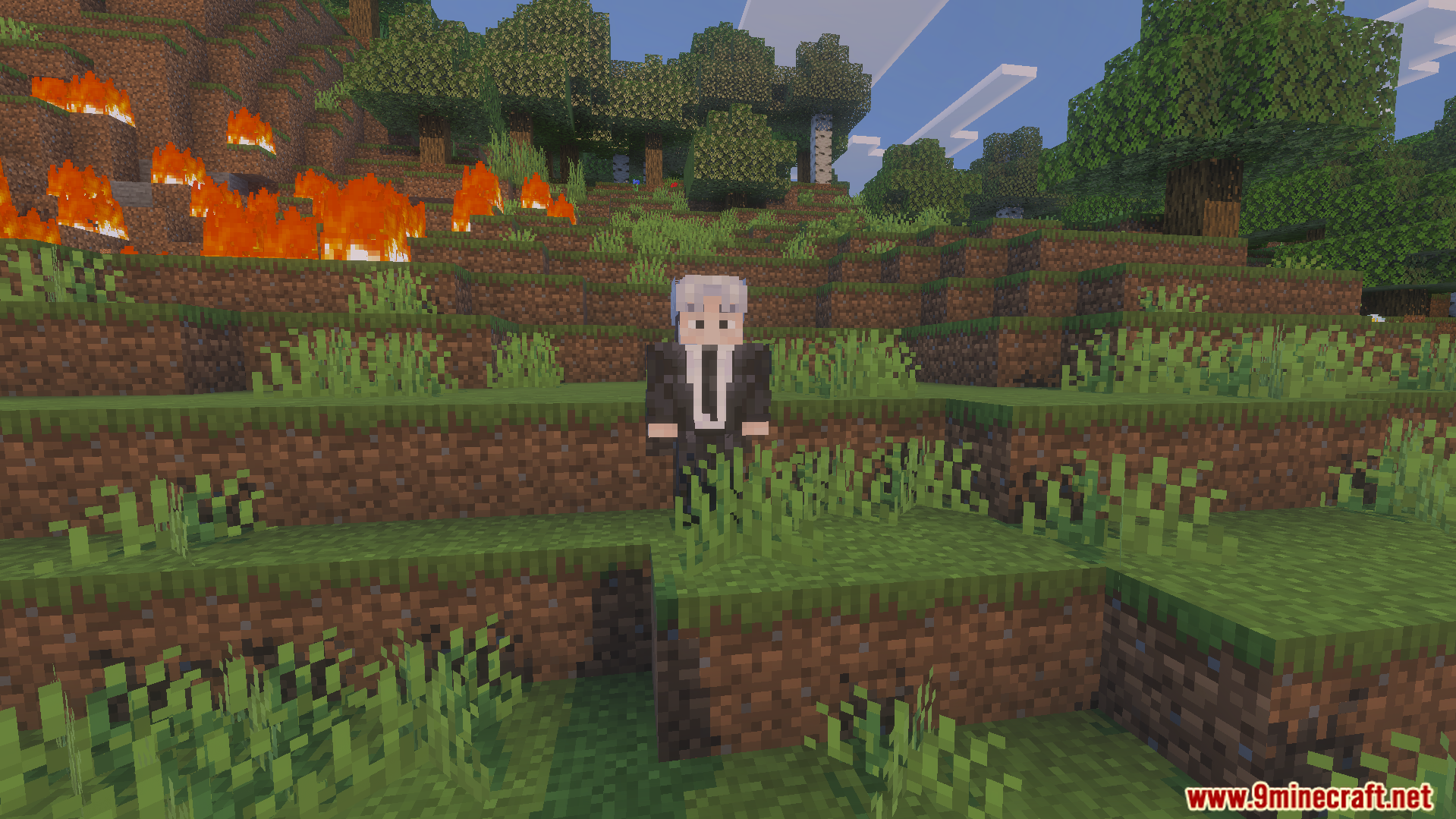 Chainsawman Addon character in a black suit standing near a burning forest