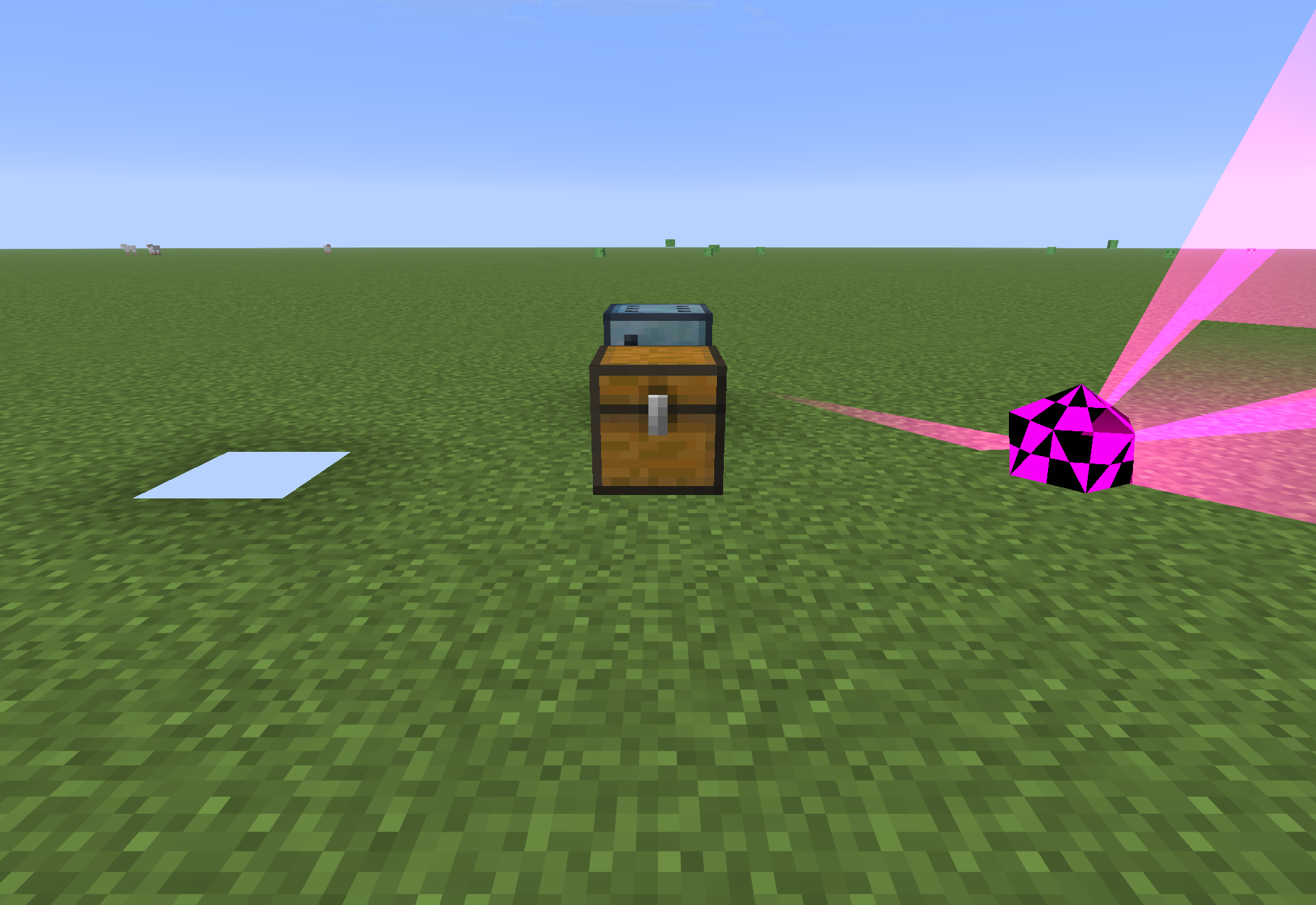 A reward chest, a Chance Cube item and the pink Chance Icosahedron beaming light into the sky.