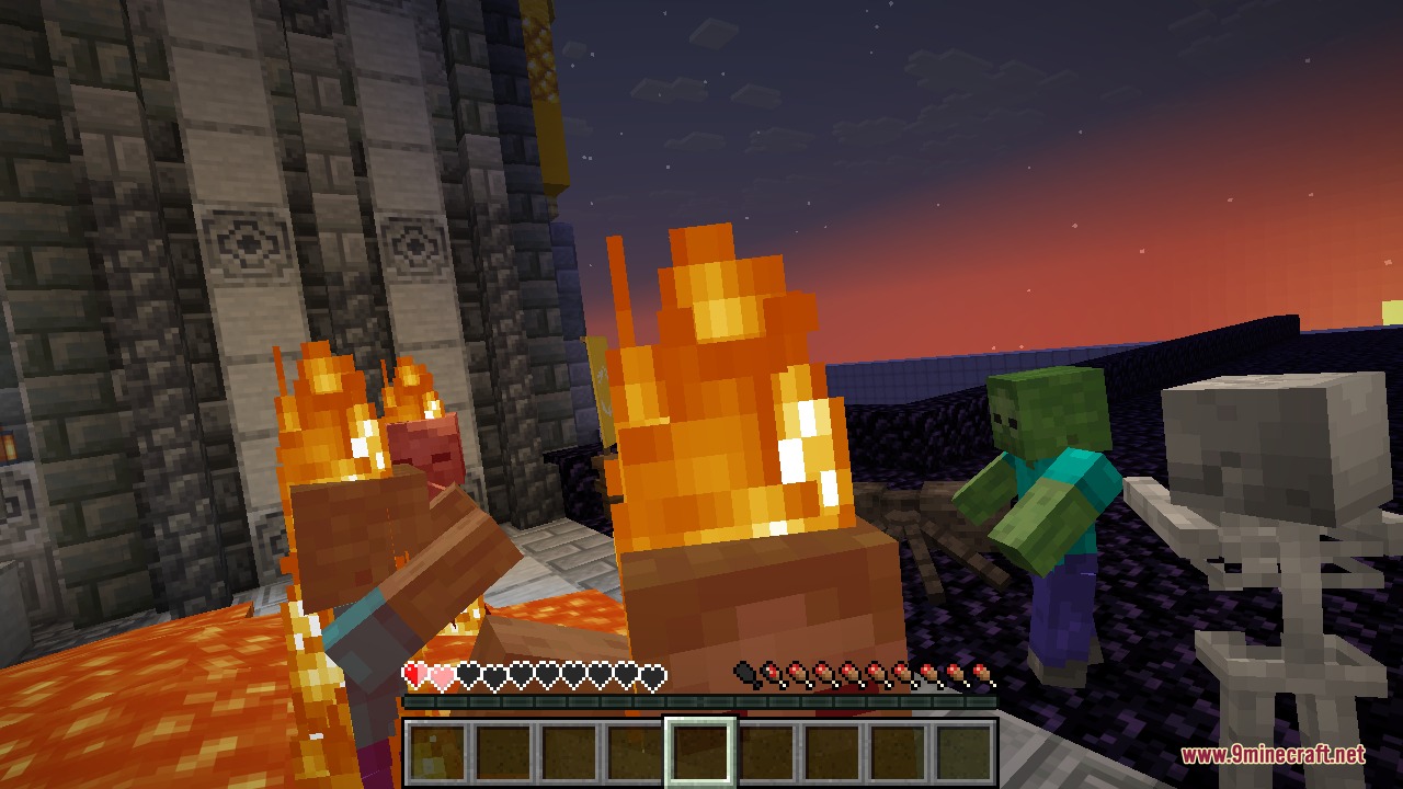 Low on health and burning in lava next to a zombie and a skeleton, moments before the equipped totem saves the player from death