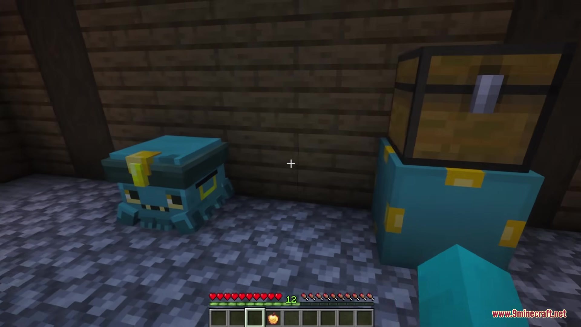 Chestmonster Mod Screenshot 2 A small blue creature block sits next to a chest on a storage block