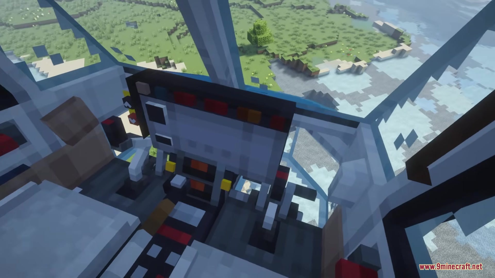The pilot perspective from inside a helicopter cabin overlooking a grassy biome